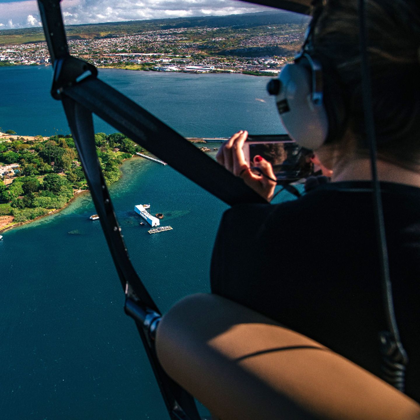 Person taking picture from helicopter