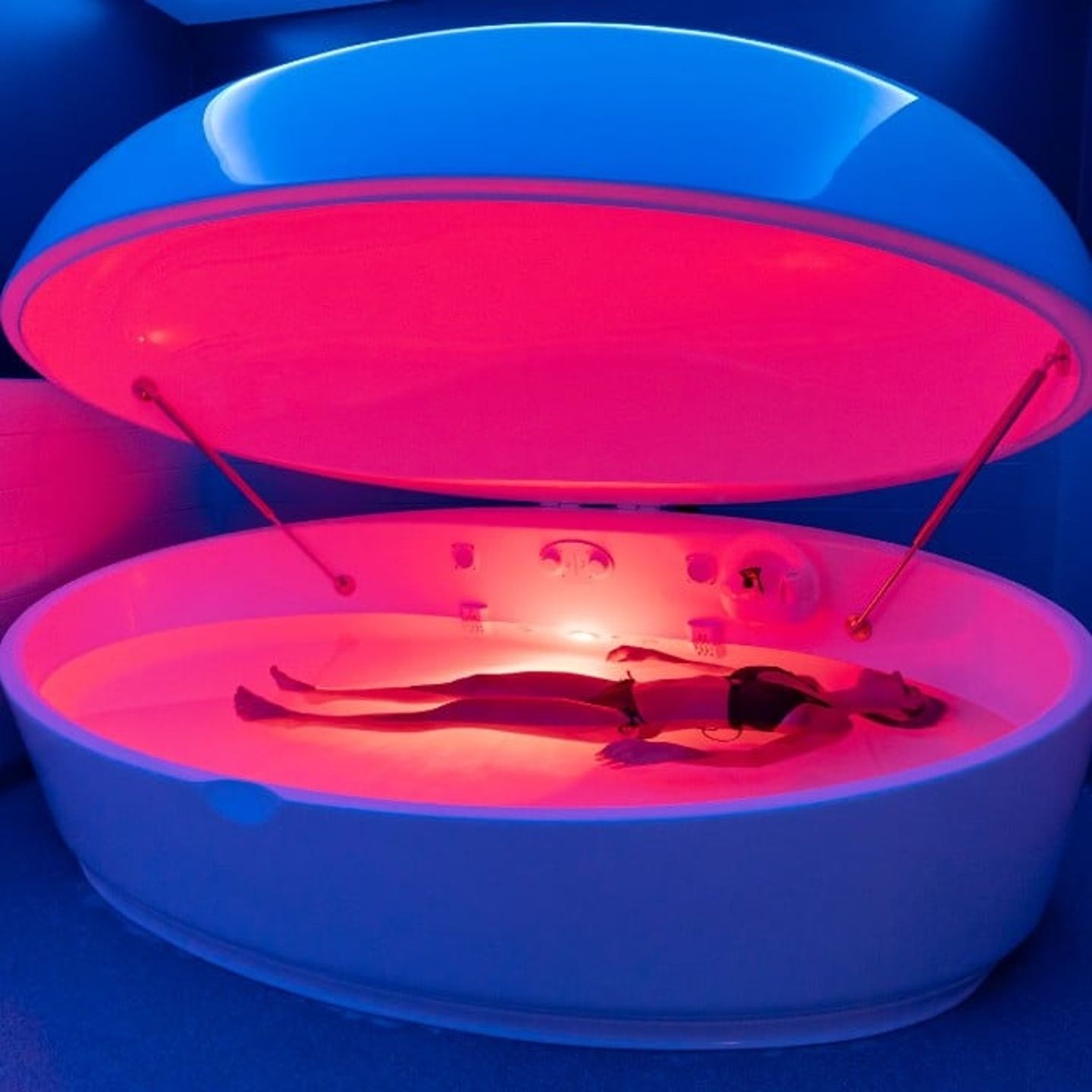 Person in pink float tank