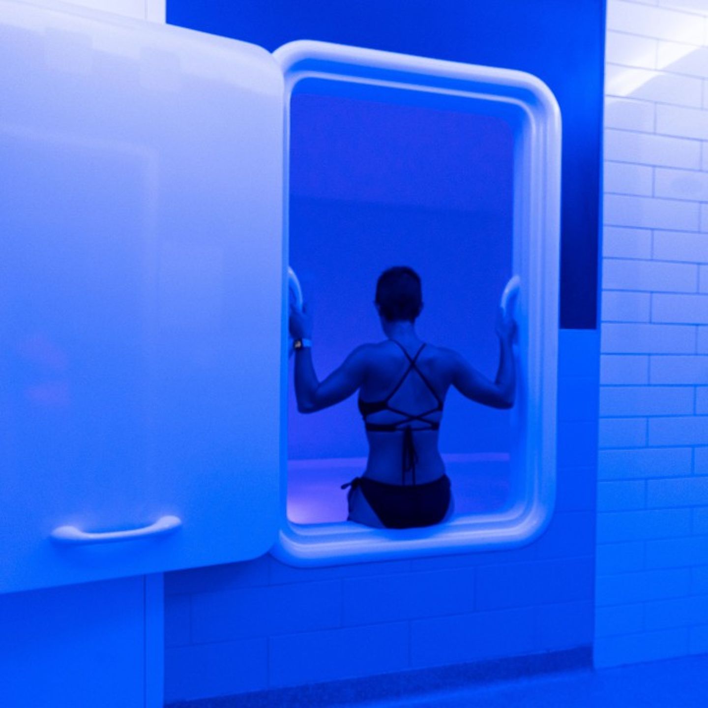 Person entering float tank