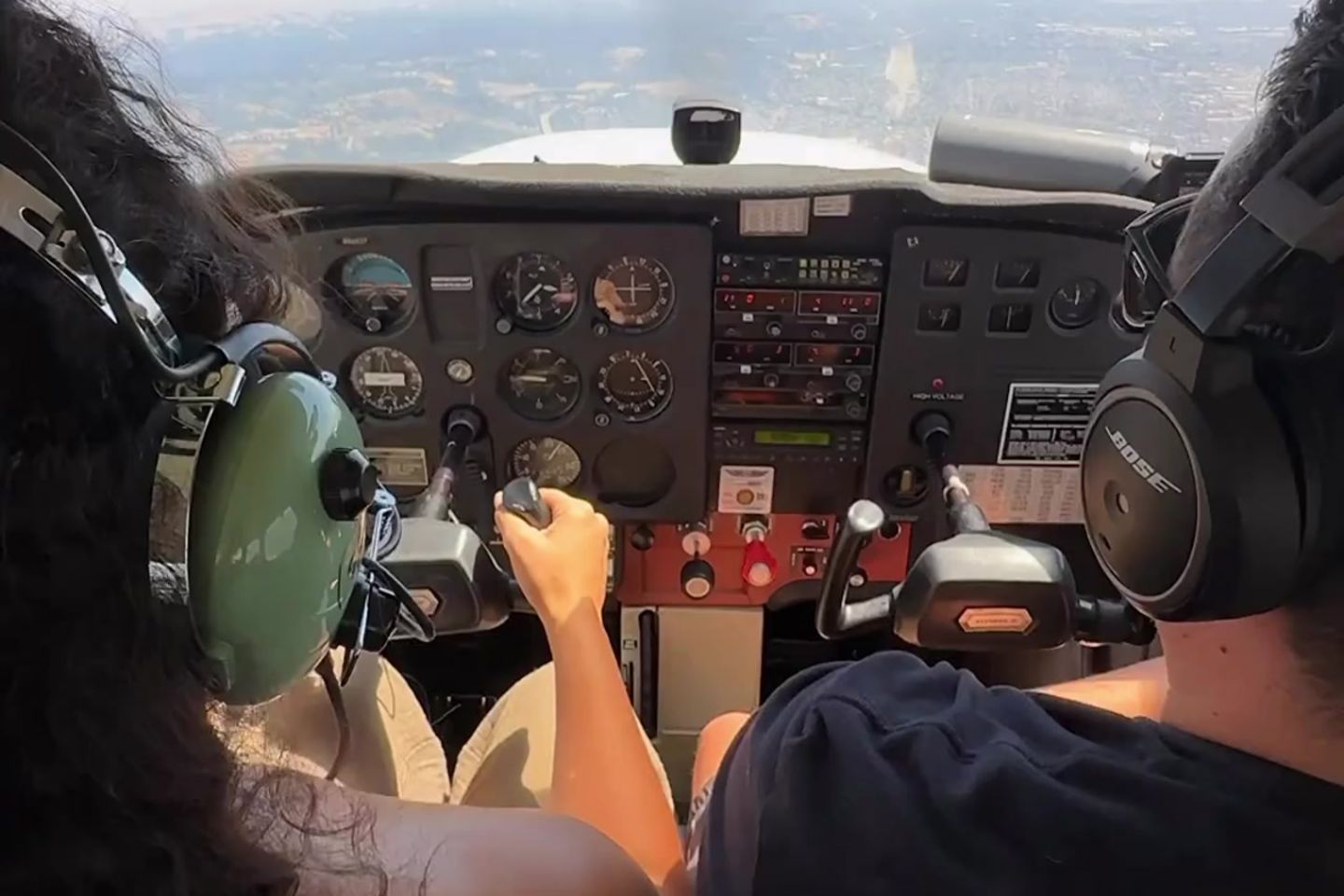 Two people flying plane