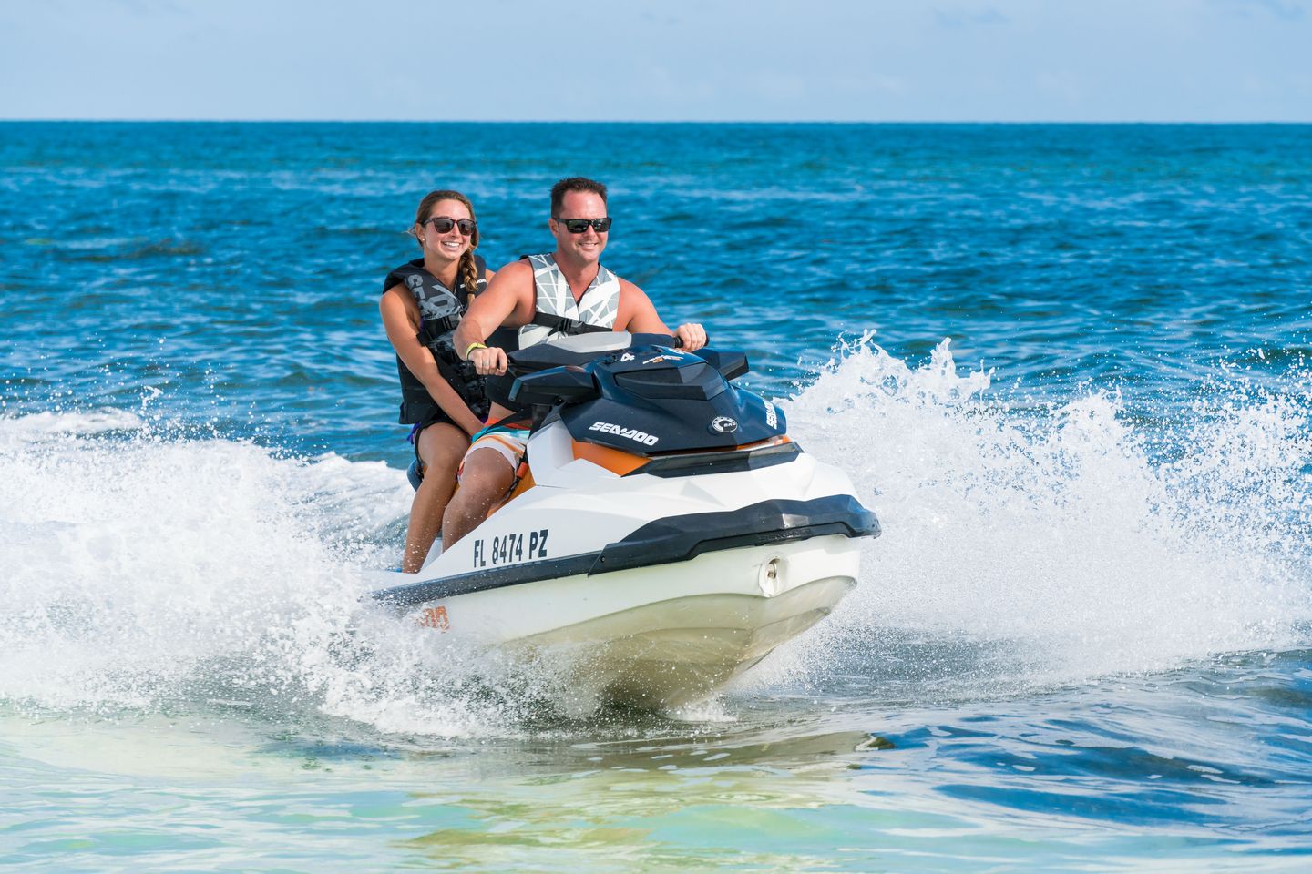 Couple jet skiing