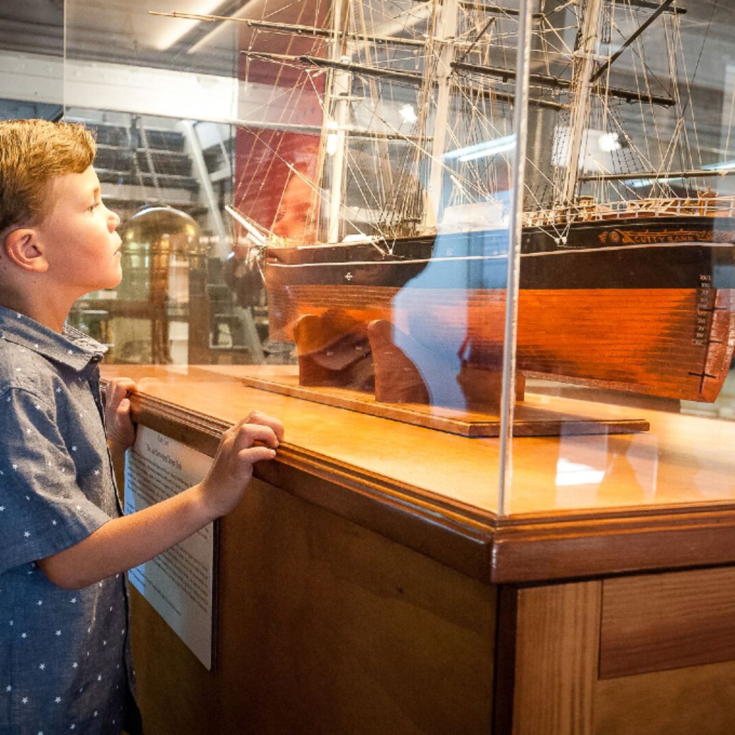 Little boy looking at ship