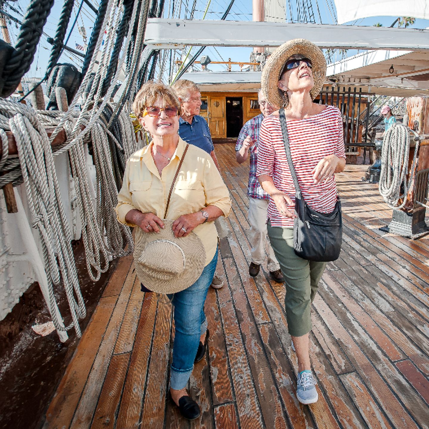 Two people walking on ship