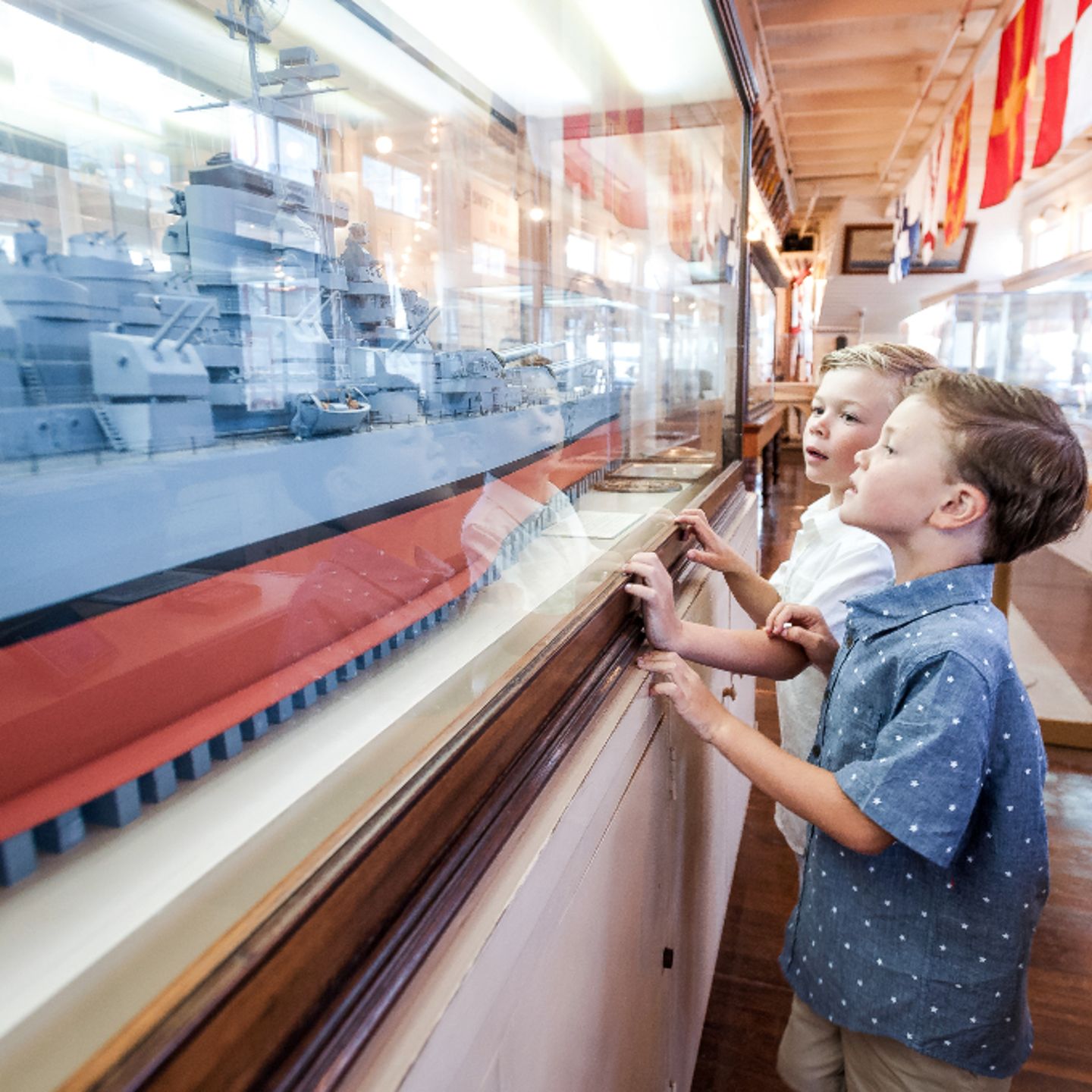 Two kids looking at boat