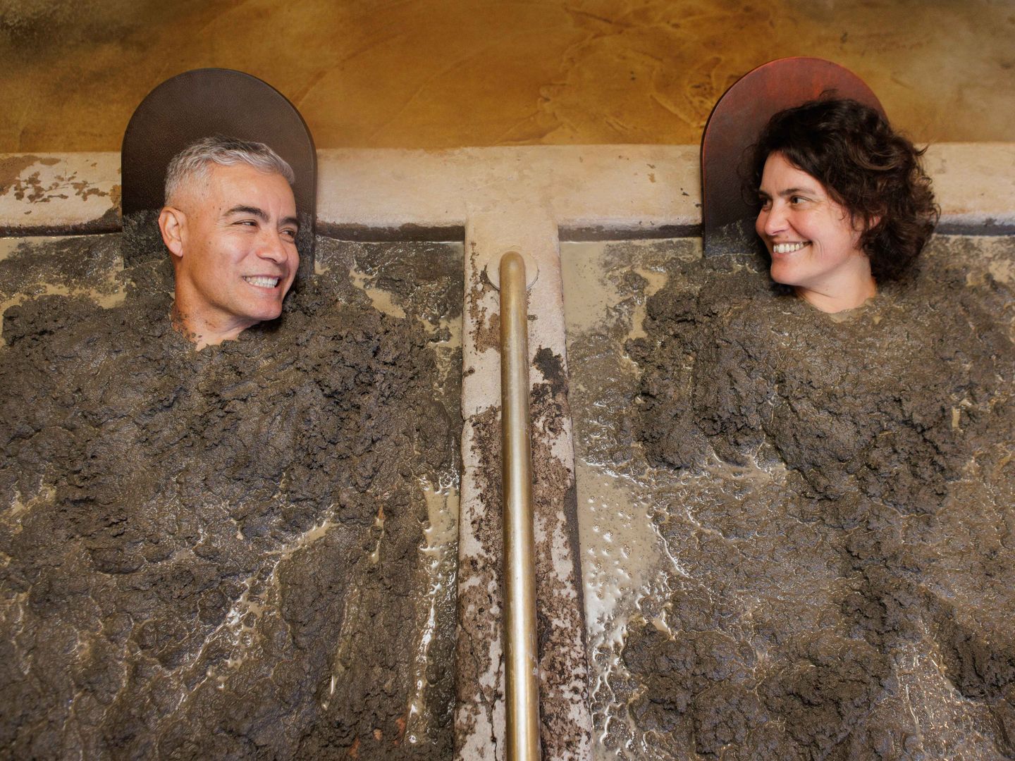 Couple in mud bath