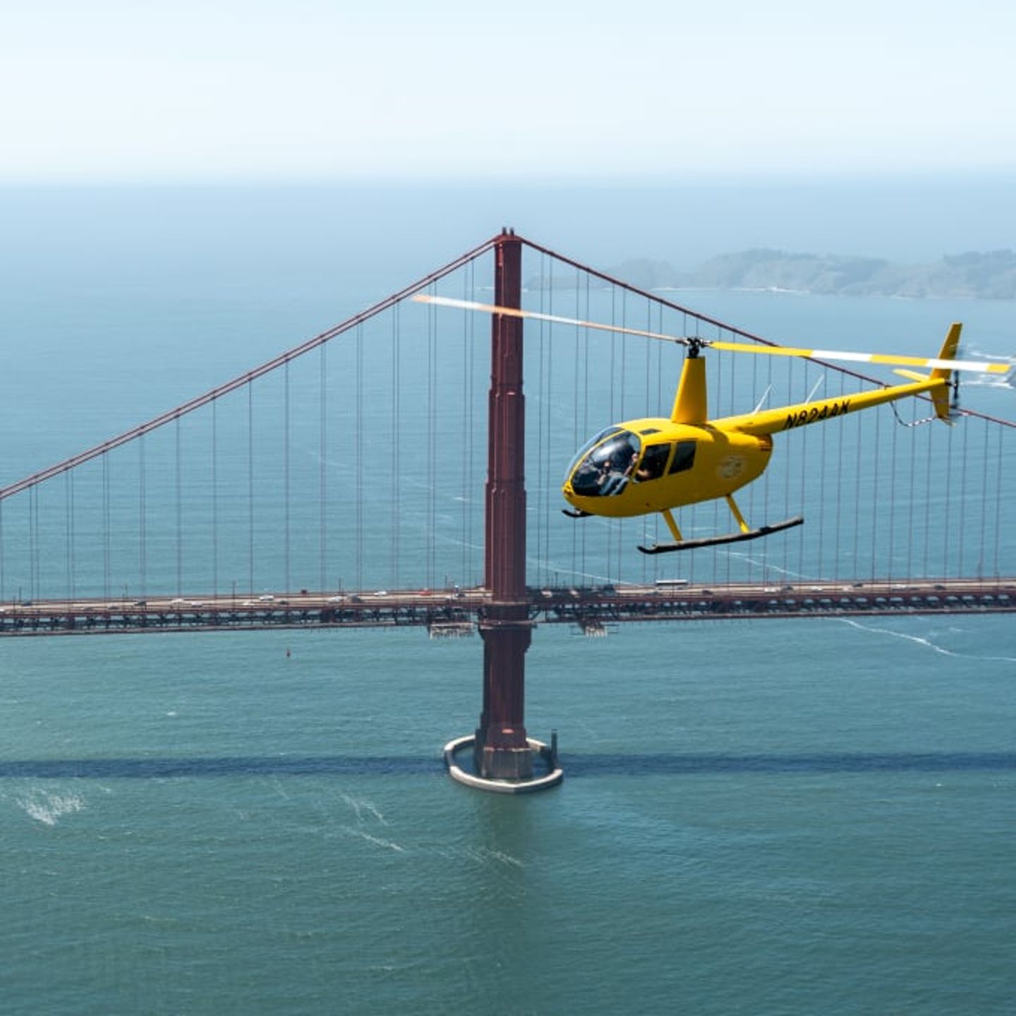 Helicopter next to bridge