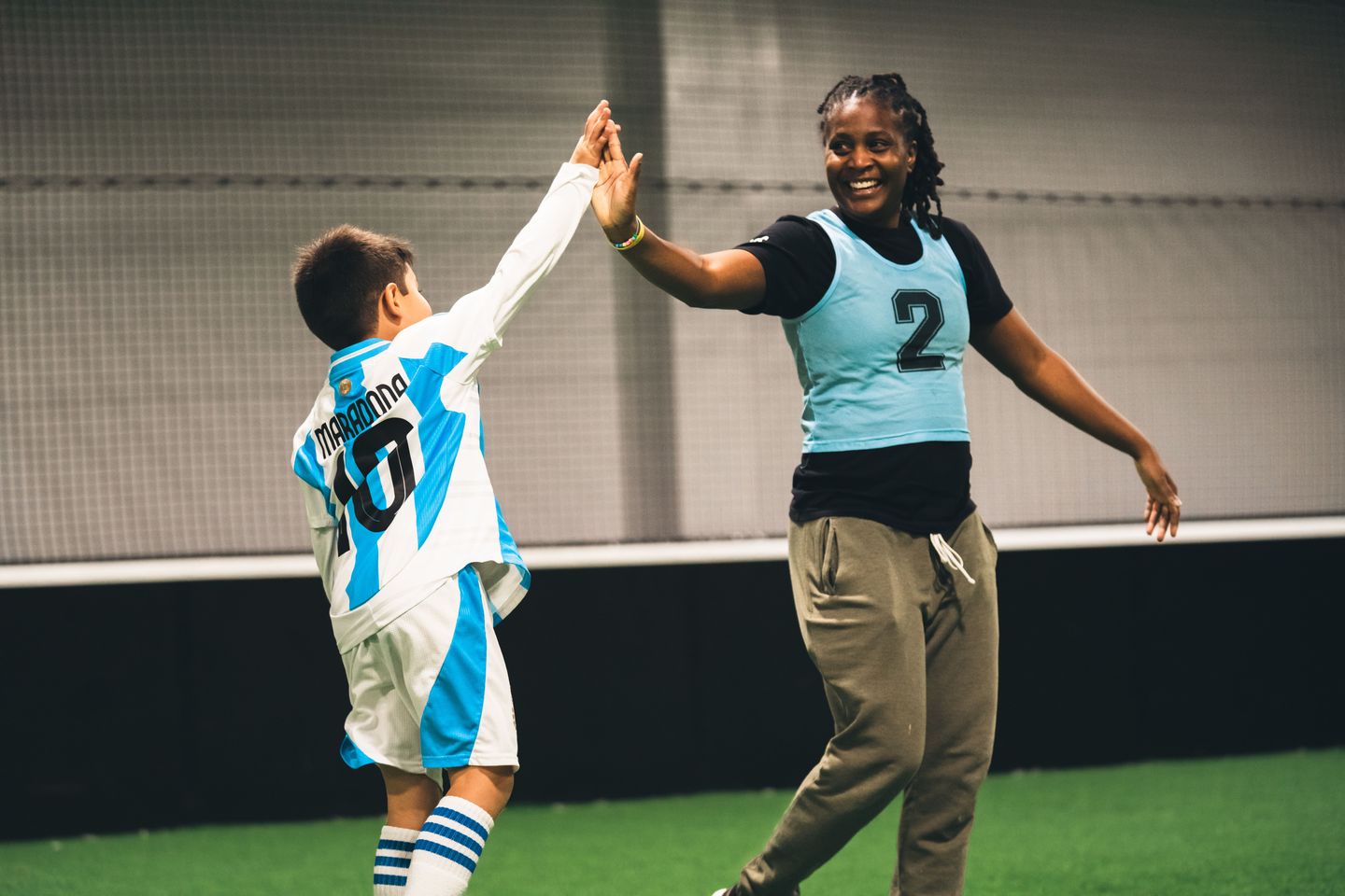 Coach Highfiving Player