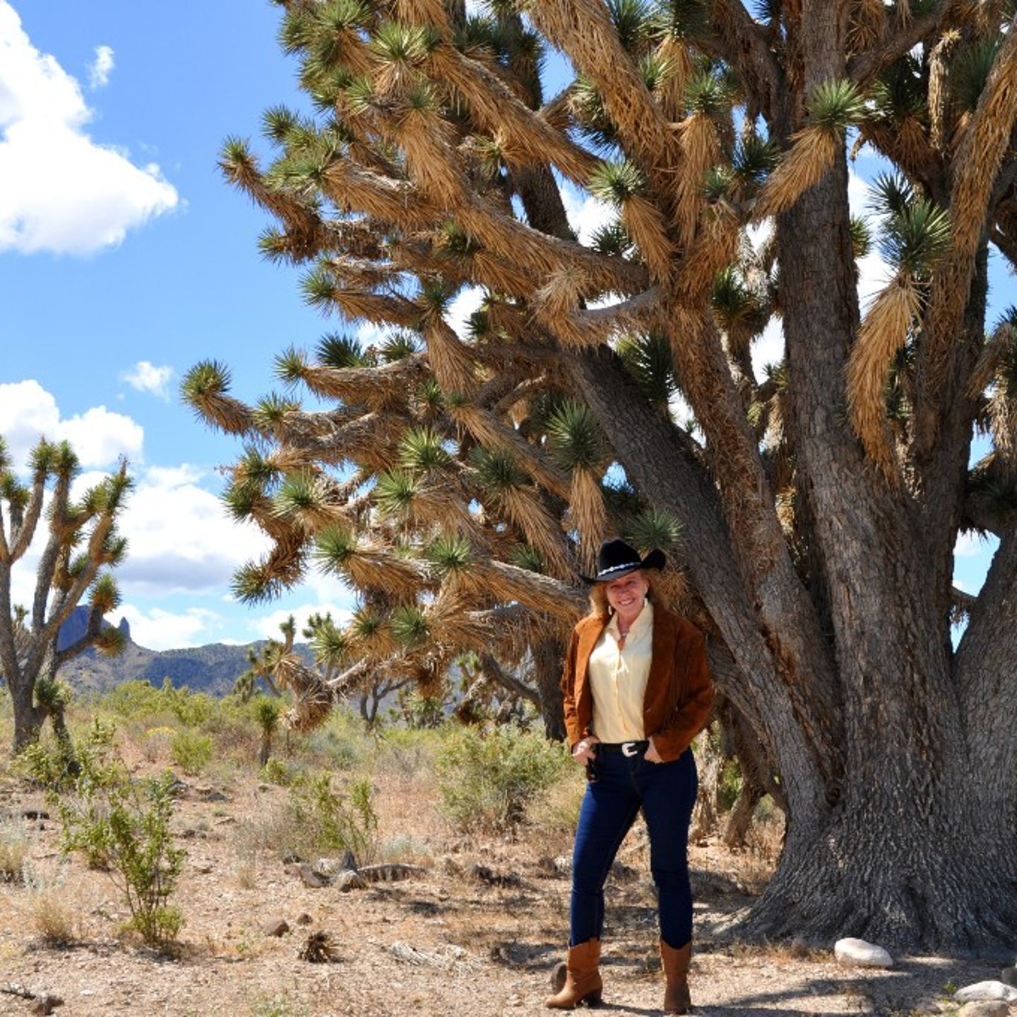 Woman posing with tree