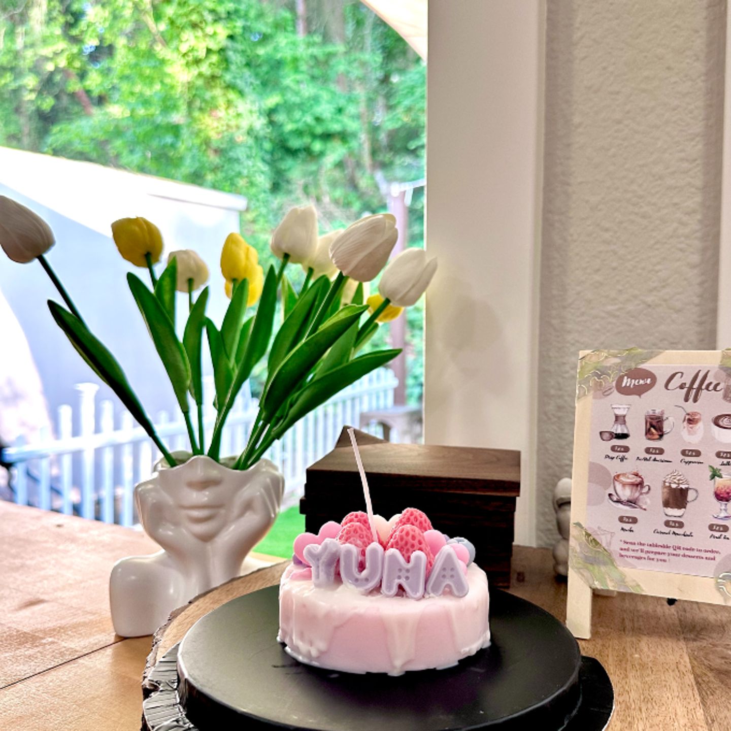 Cake candle on table