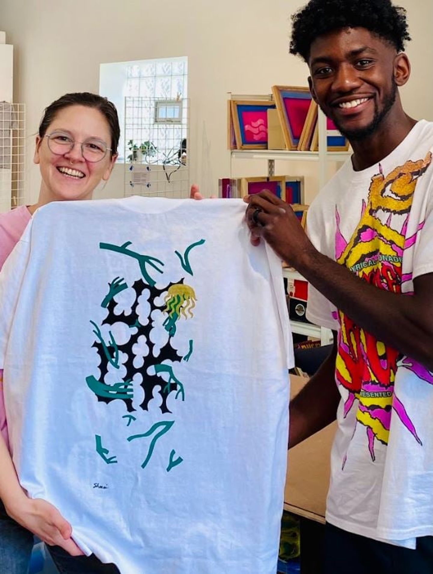 Couple Holding Shirt