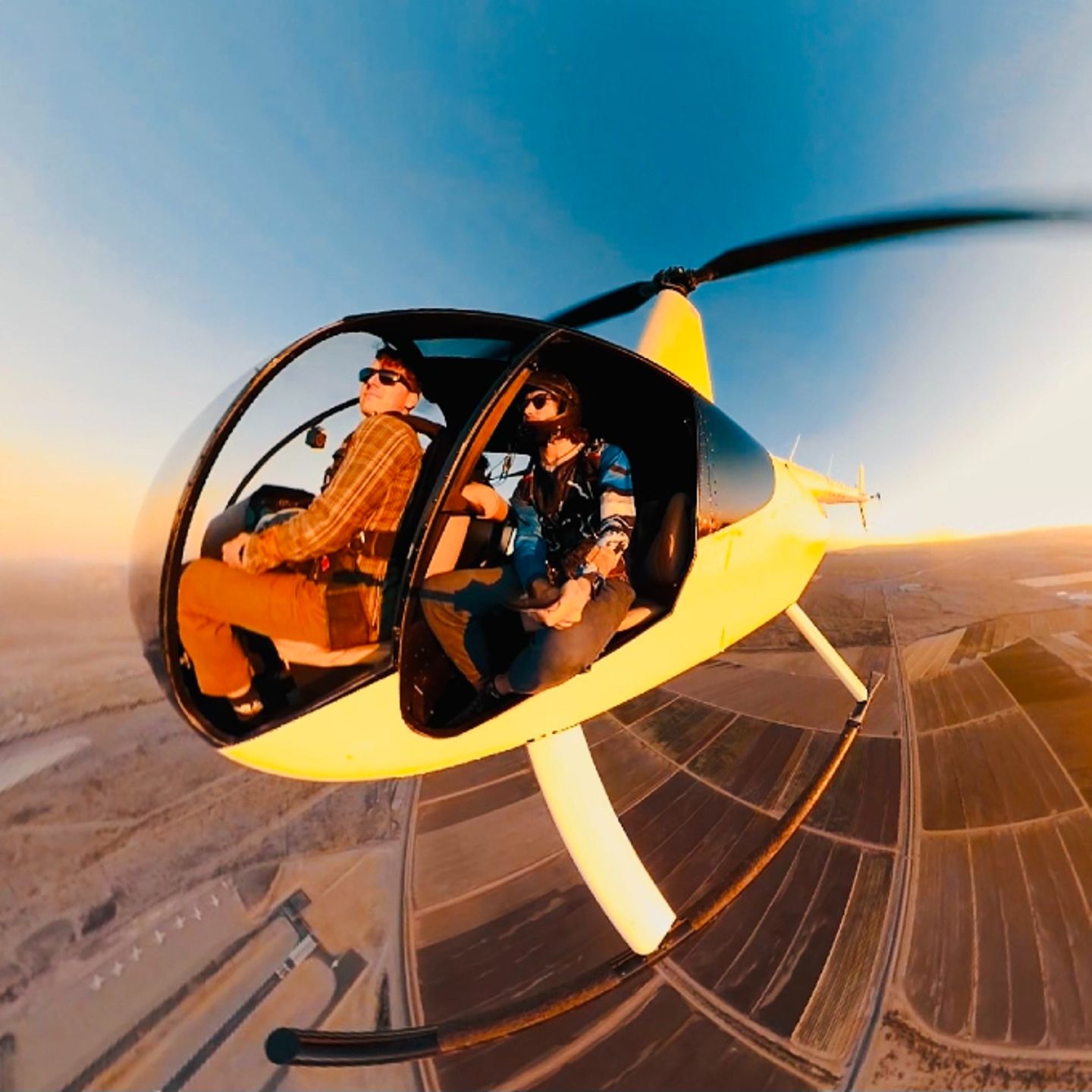 People flying in helicopter