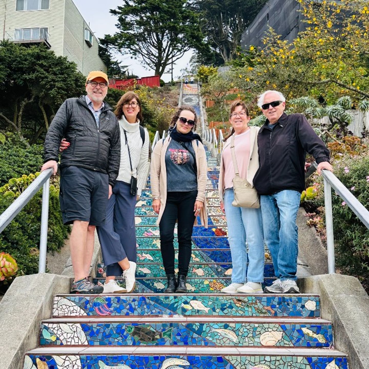 Family posing on stairs