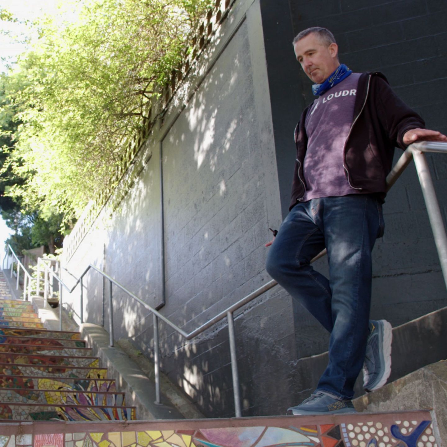 Man leaning on railing