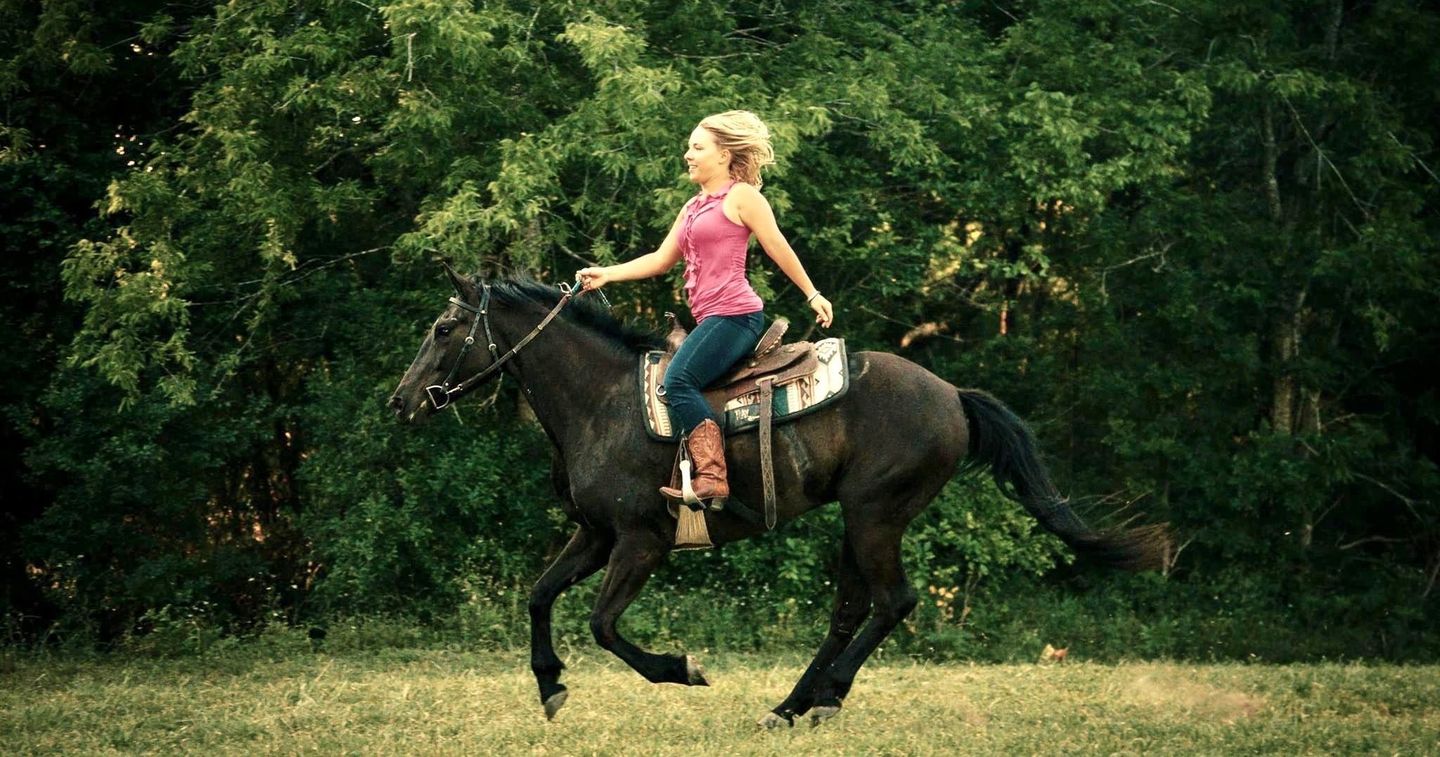 Woman riding on horse