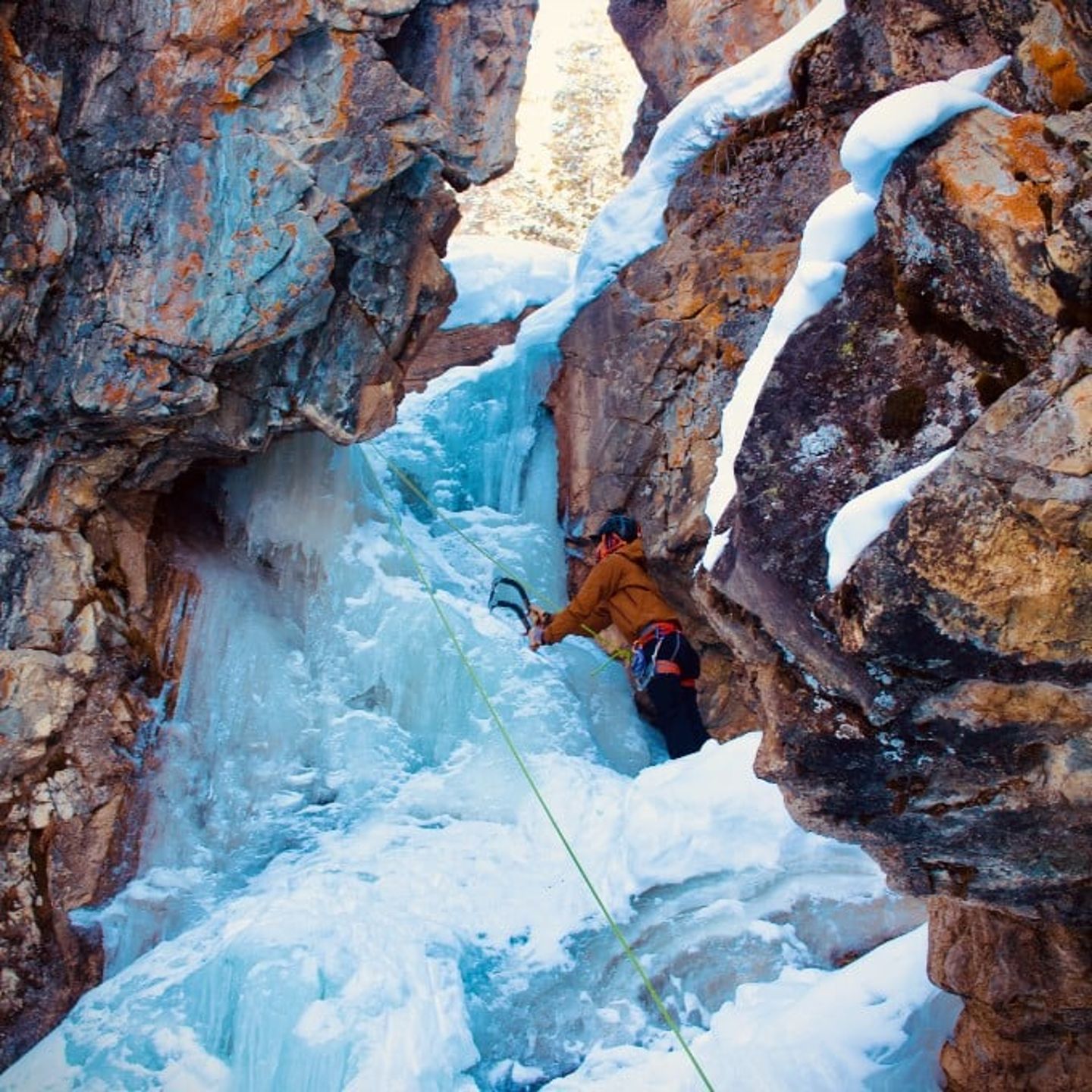 Person climbing up rock