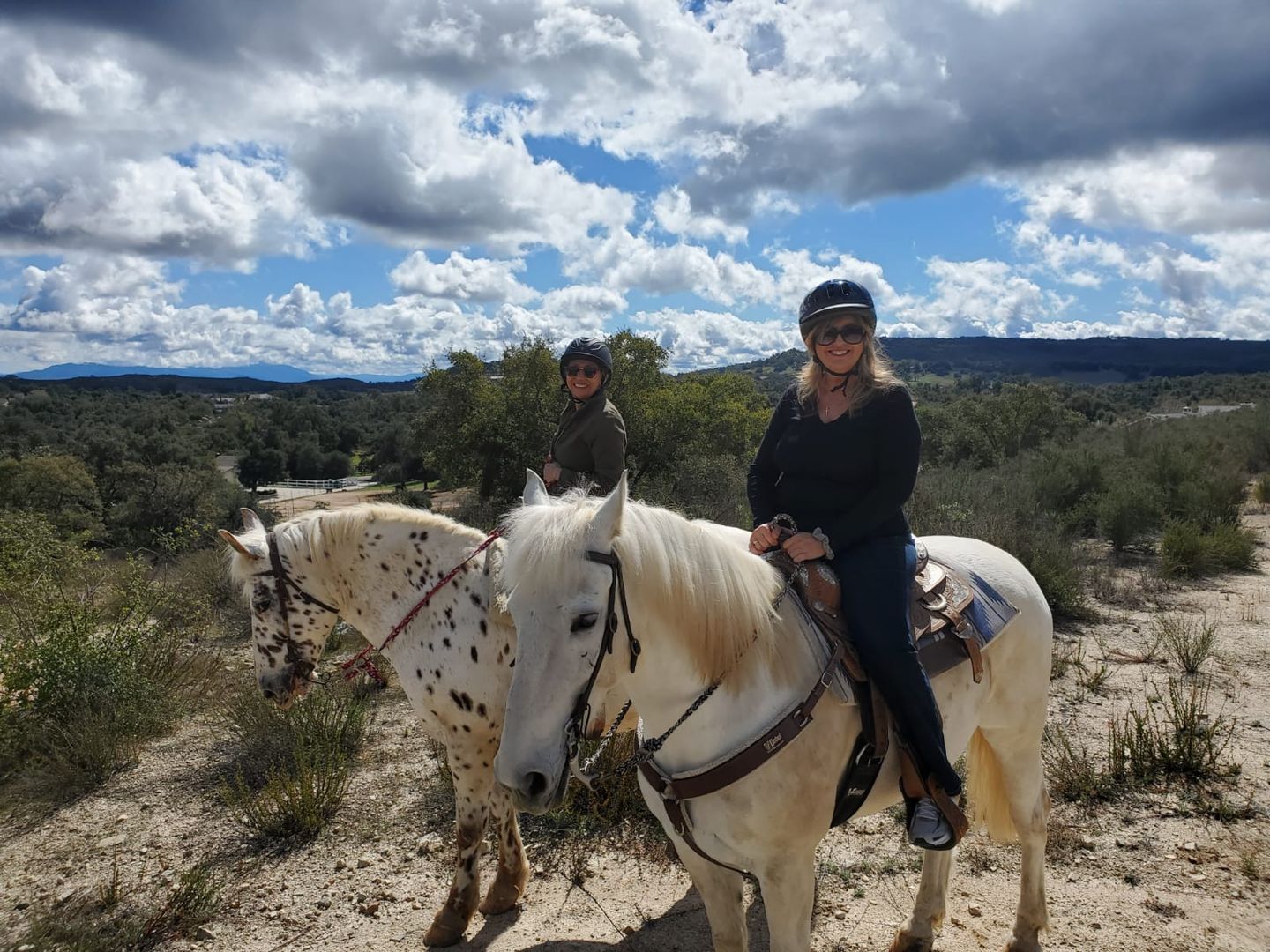 Two people on horses