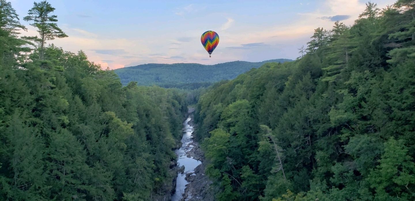 Balloon in sky over river