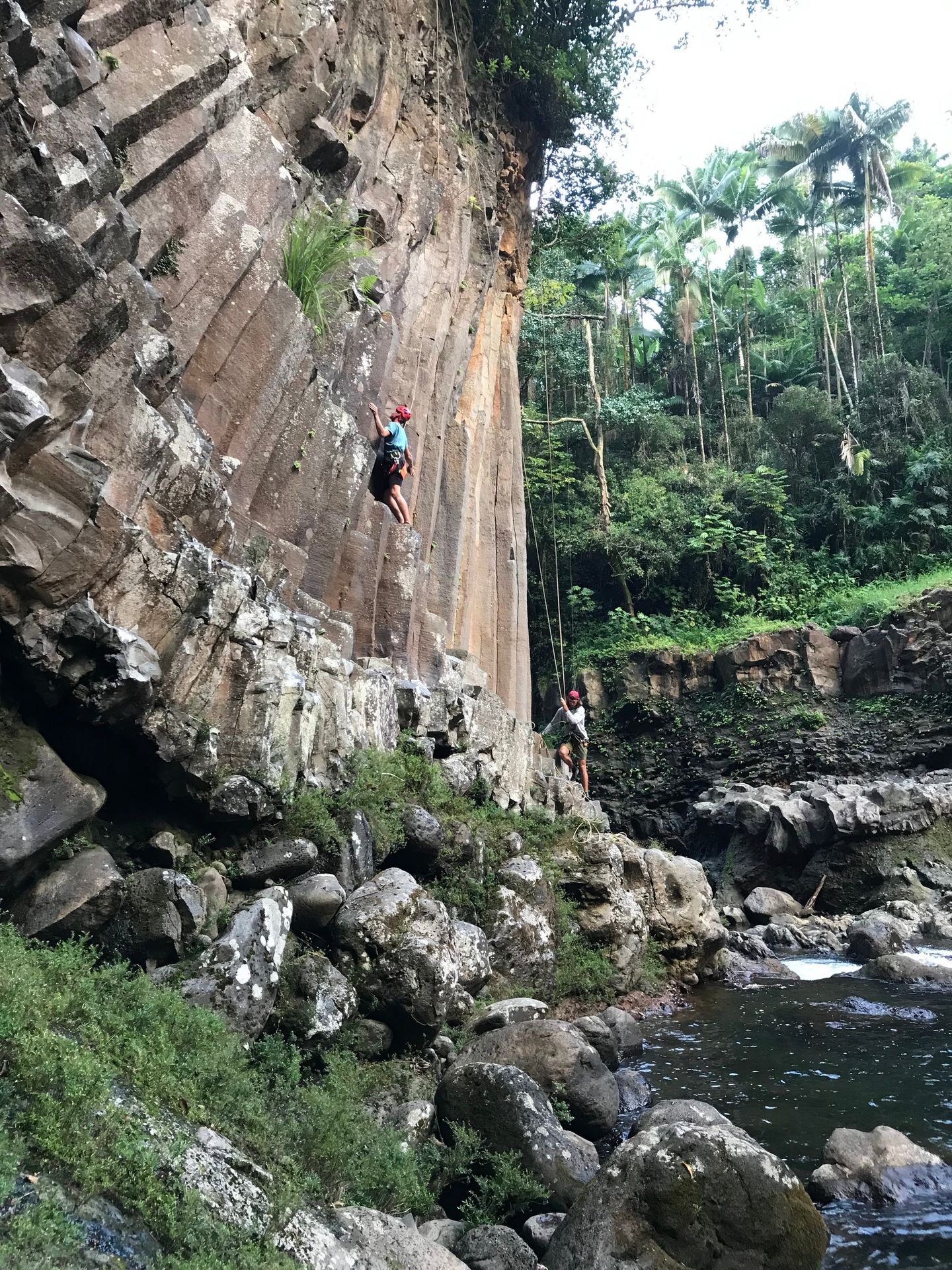 Person climbing rock wall