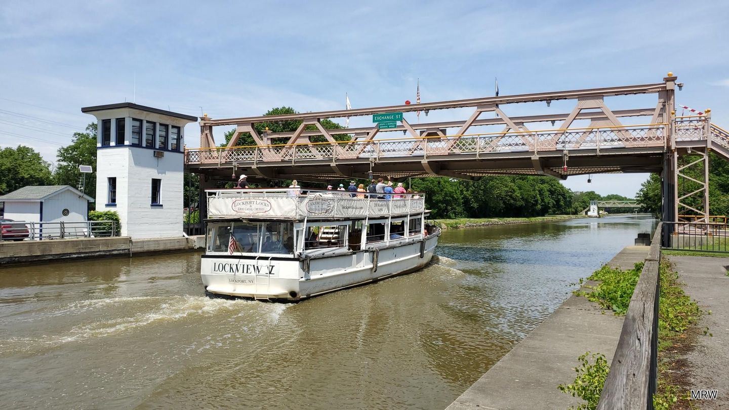 Boat going under bridge