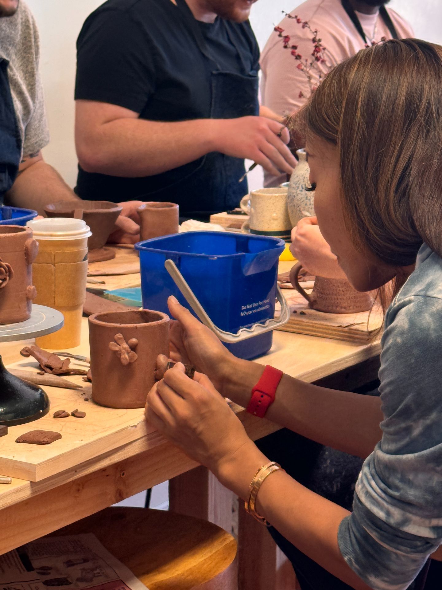 Woman sculpting pottery
