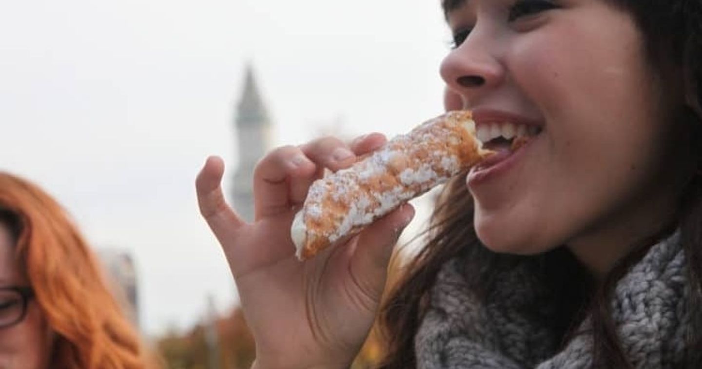 Woman eating roll