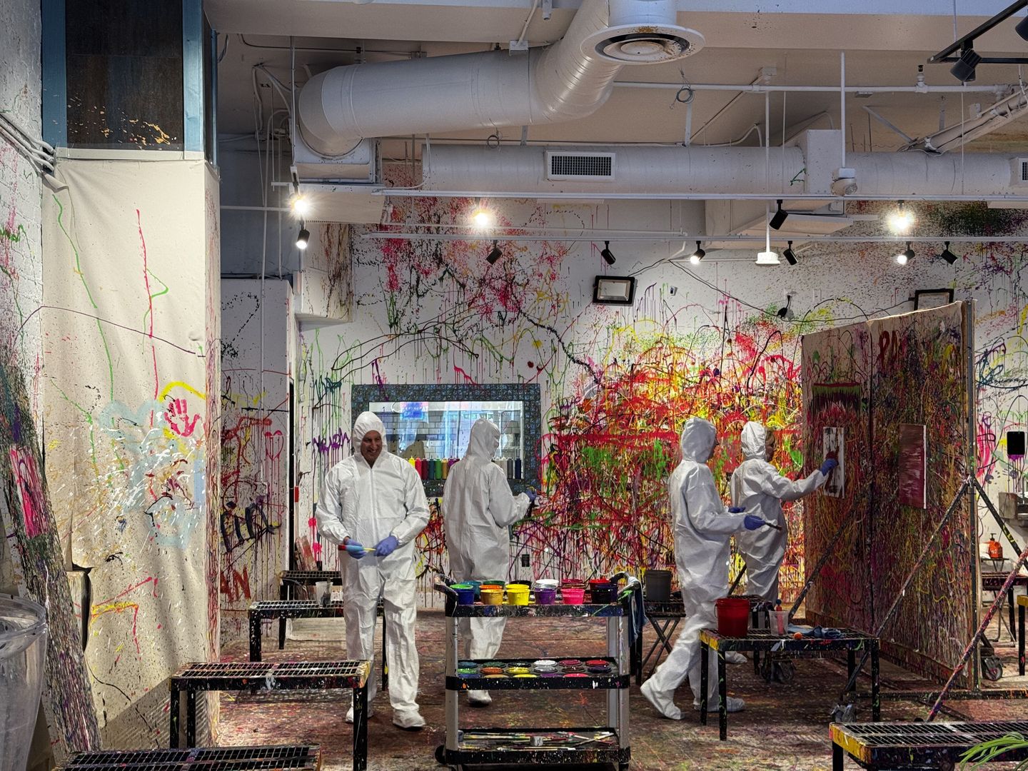 People splatter painting