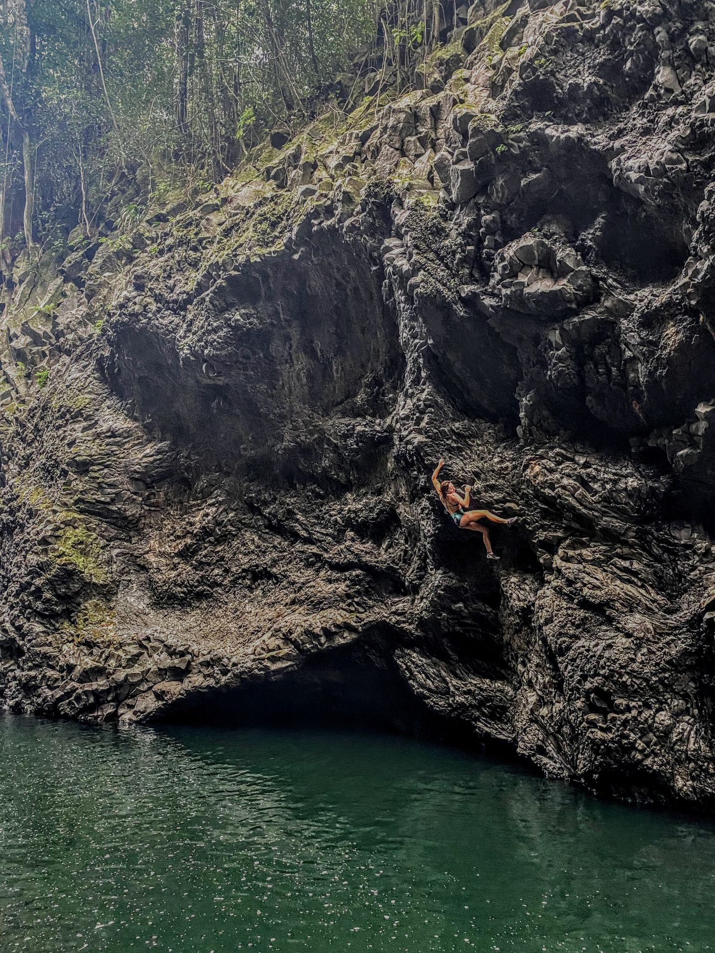 Woman on rock wall