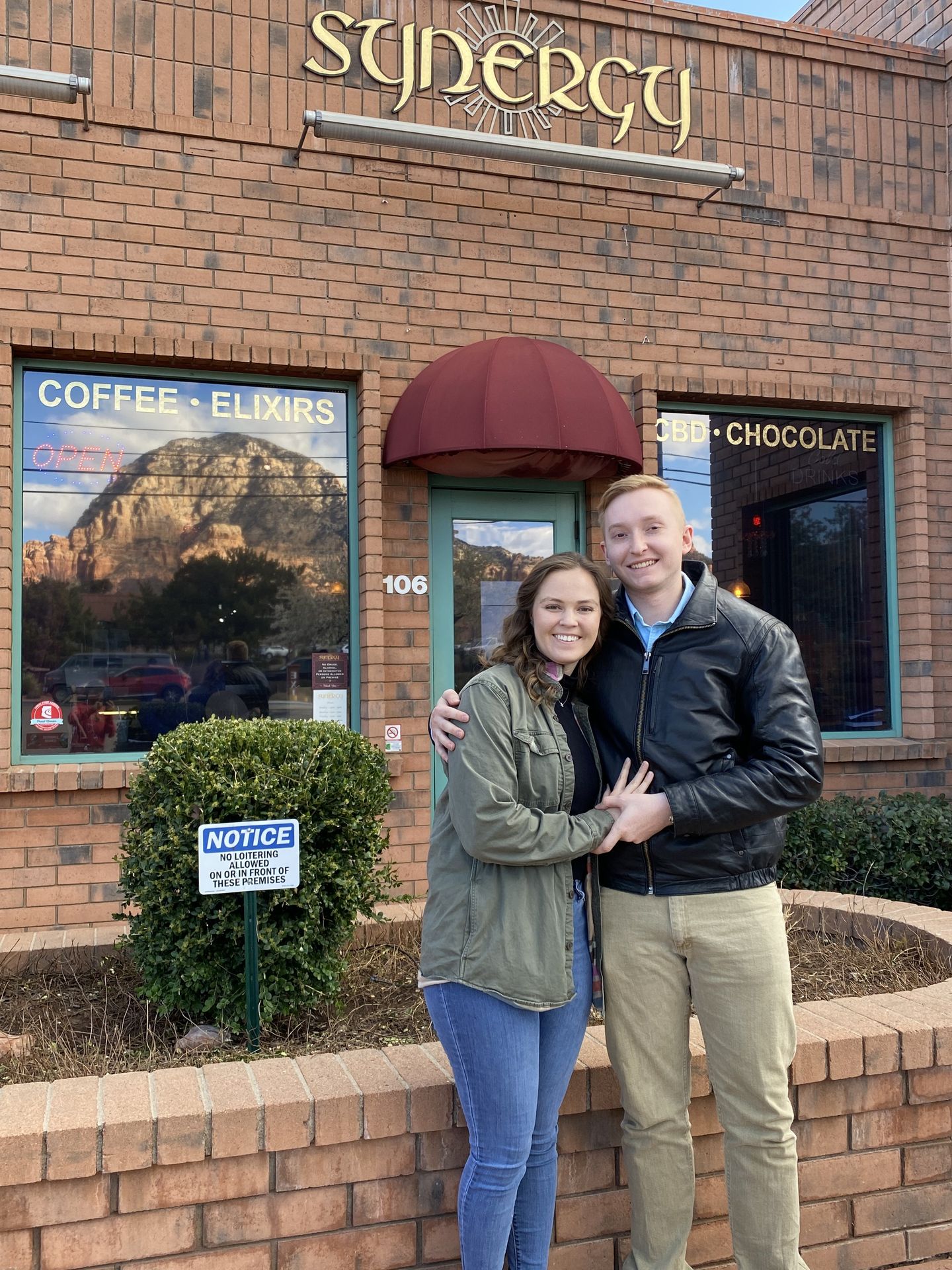 Couple in front of shop