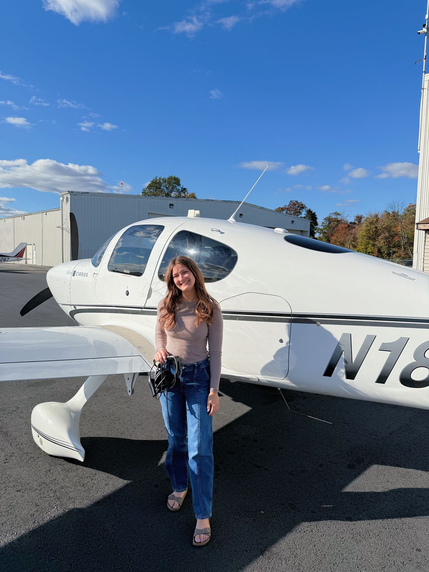 Woman next to plane