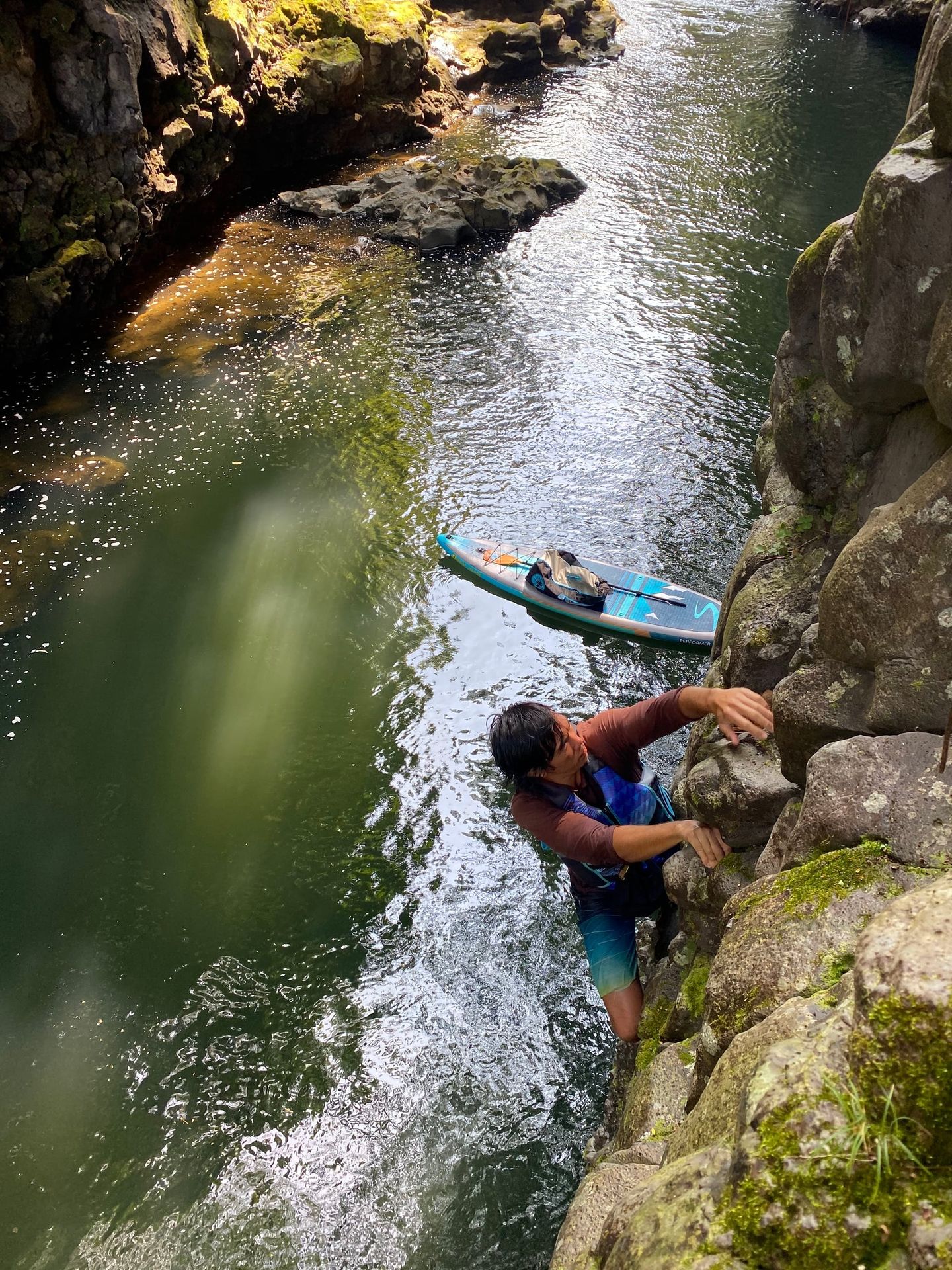 Person climbing up rocks
