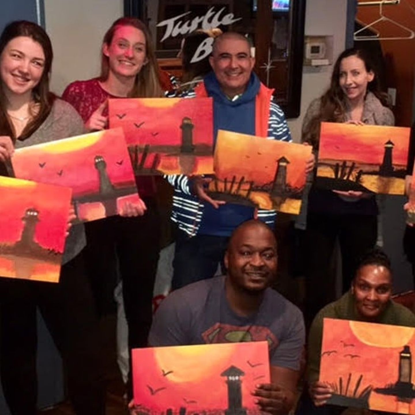 Group Posing with Finished Art