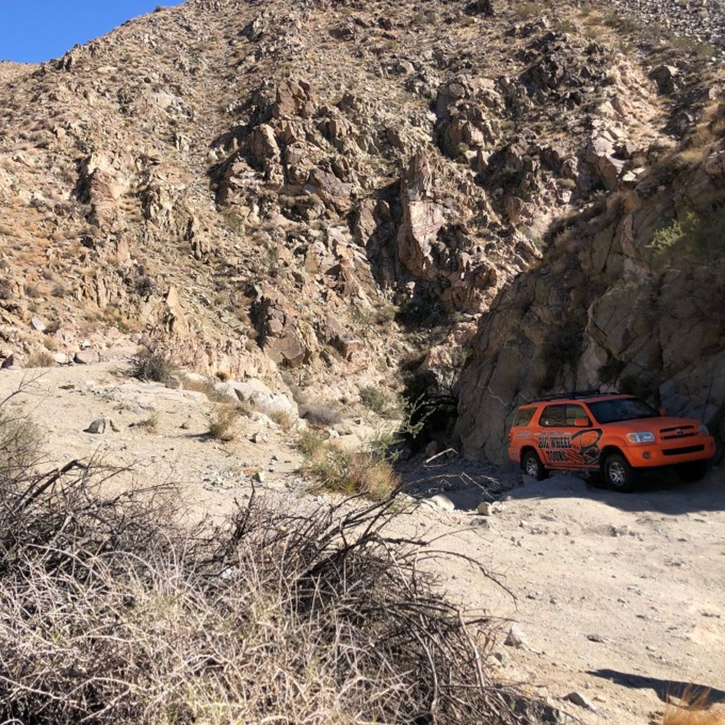 Jeep driving up mountain