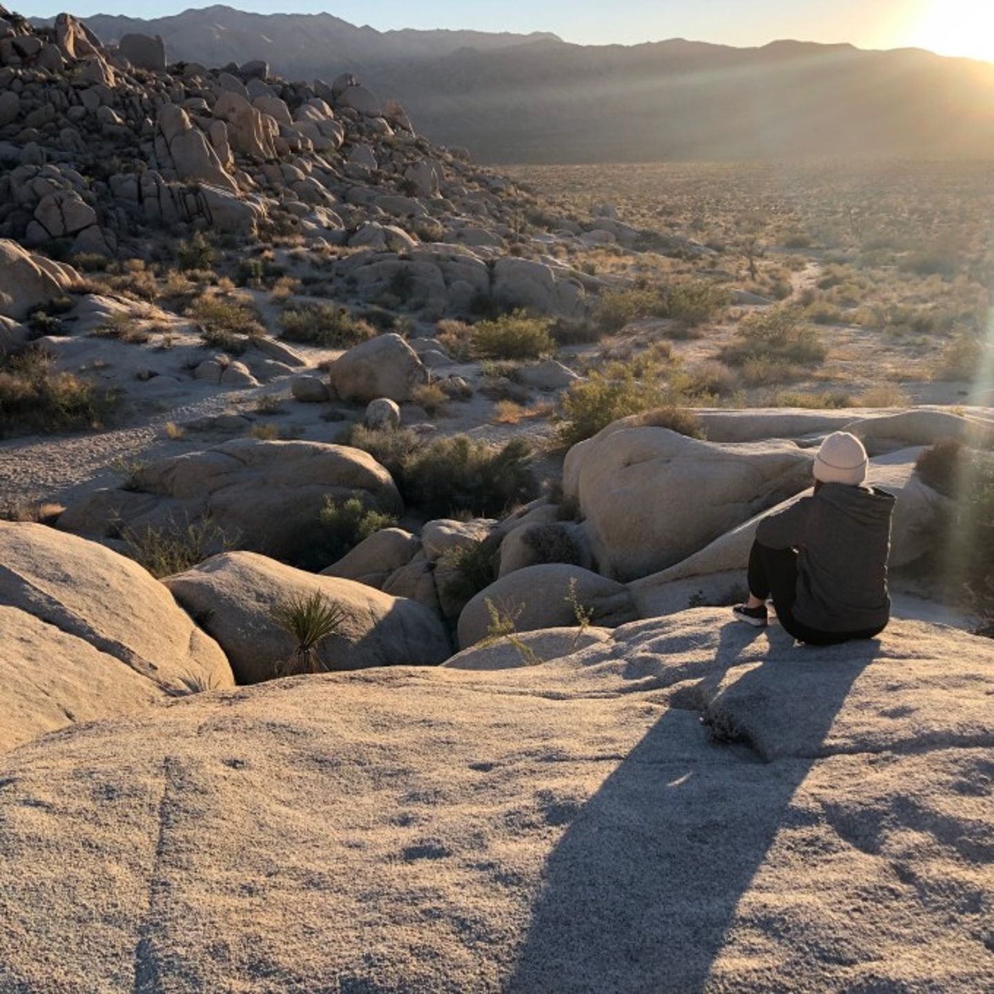Woman sitting on rock