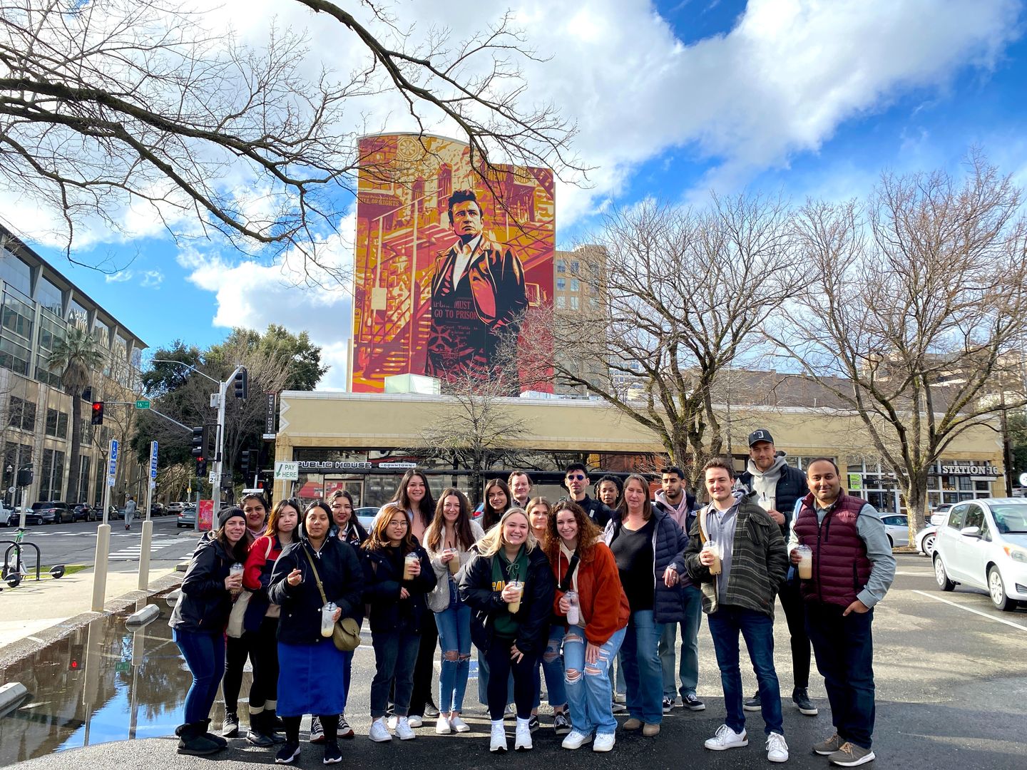 Group in front of mural