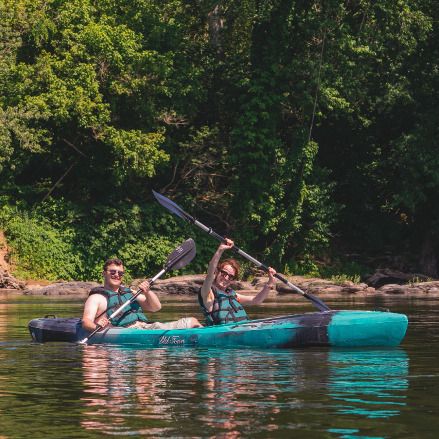Two people tandem kayaking