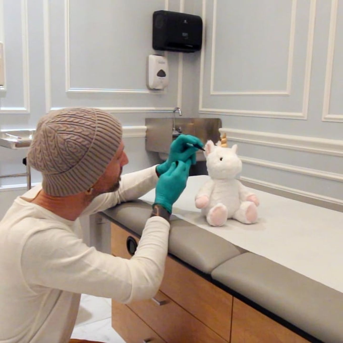 Unicorn getting ear pierced