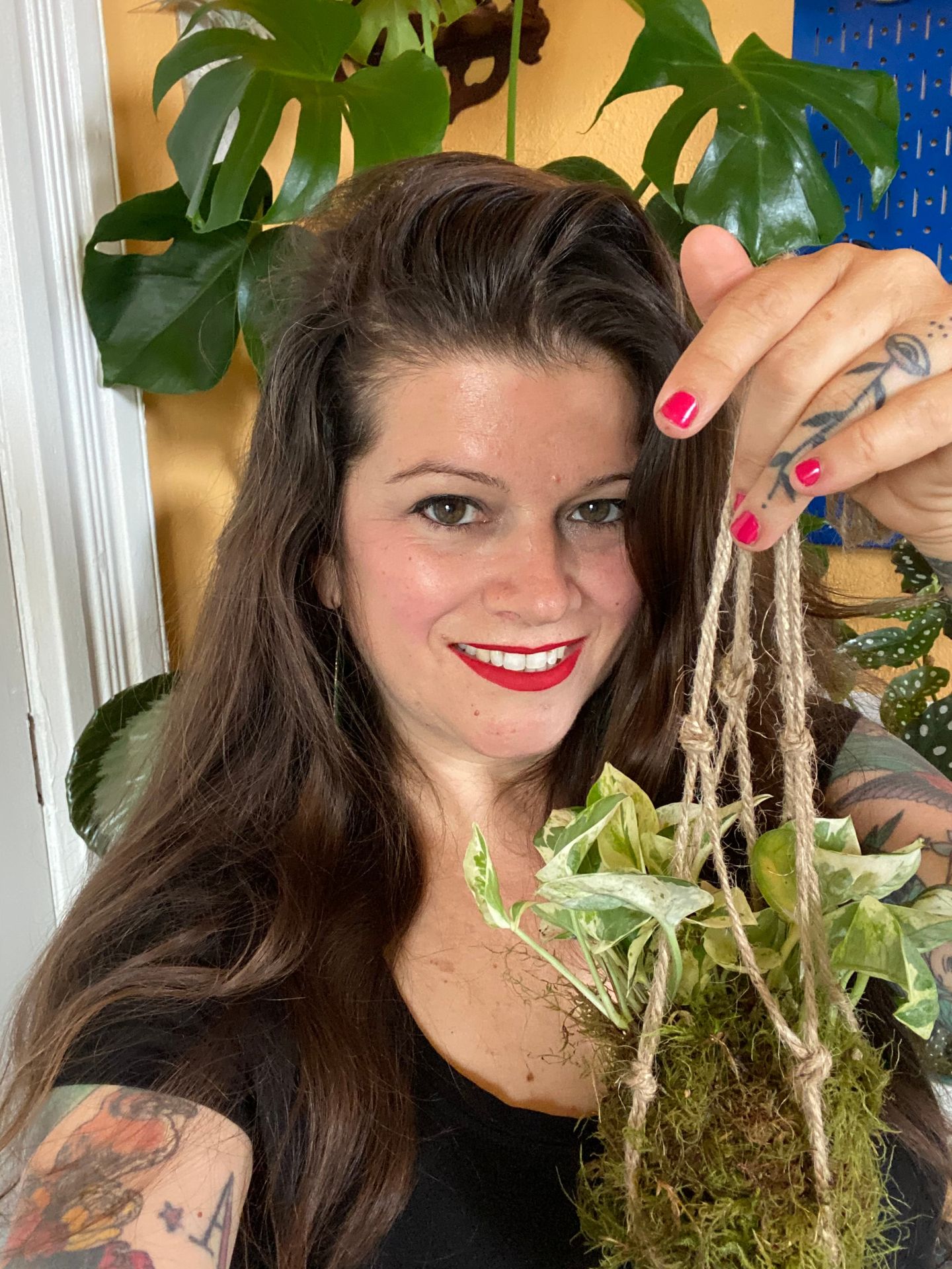 Woman with hanging plant
