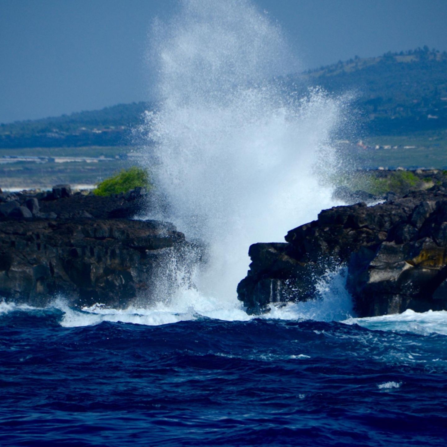 Water splashing up rocks