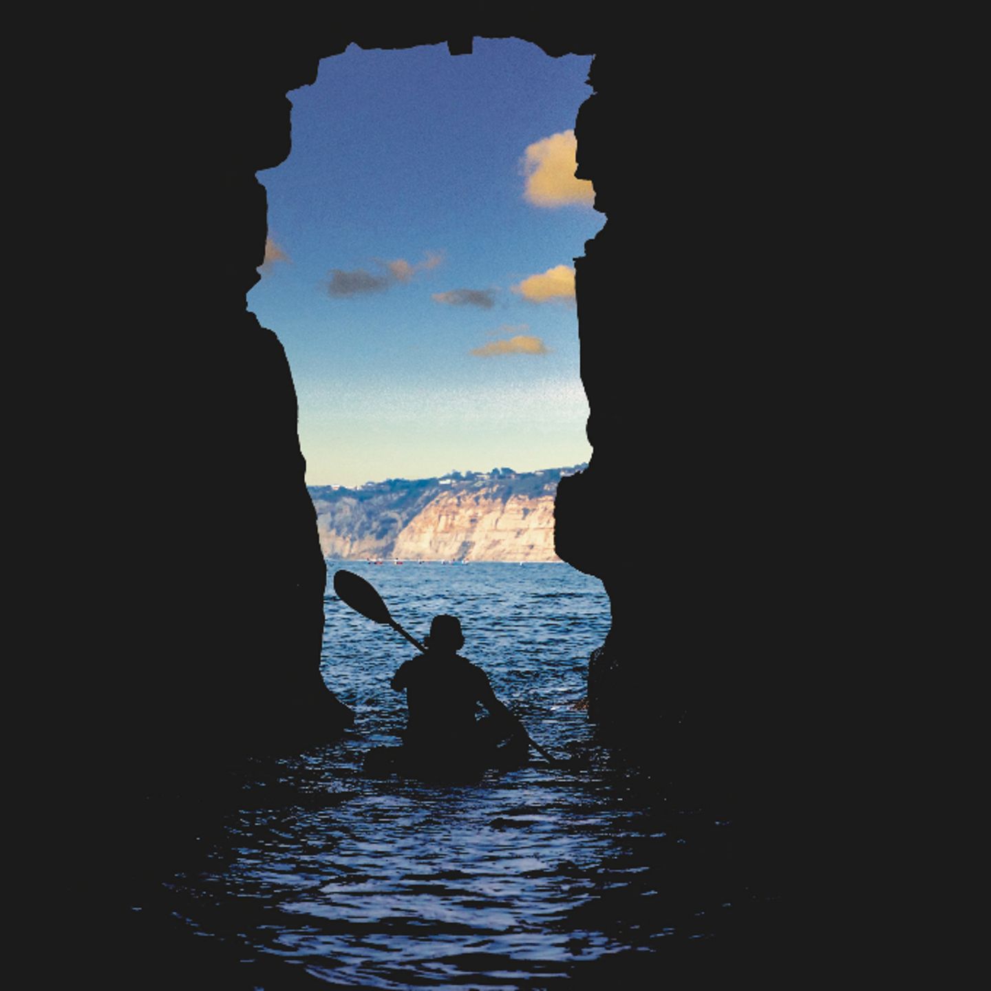 Person kayaking in cave