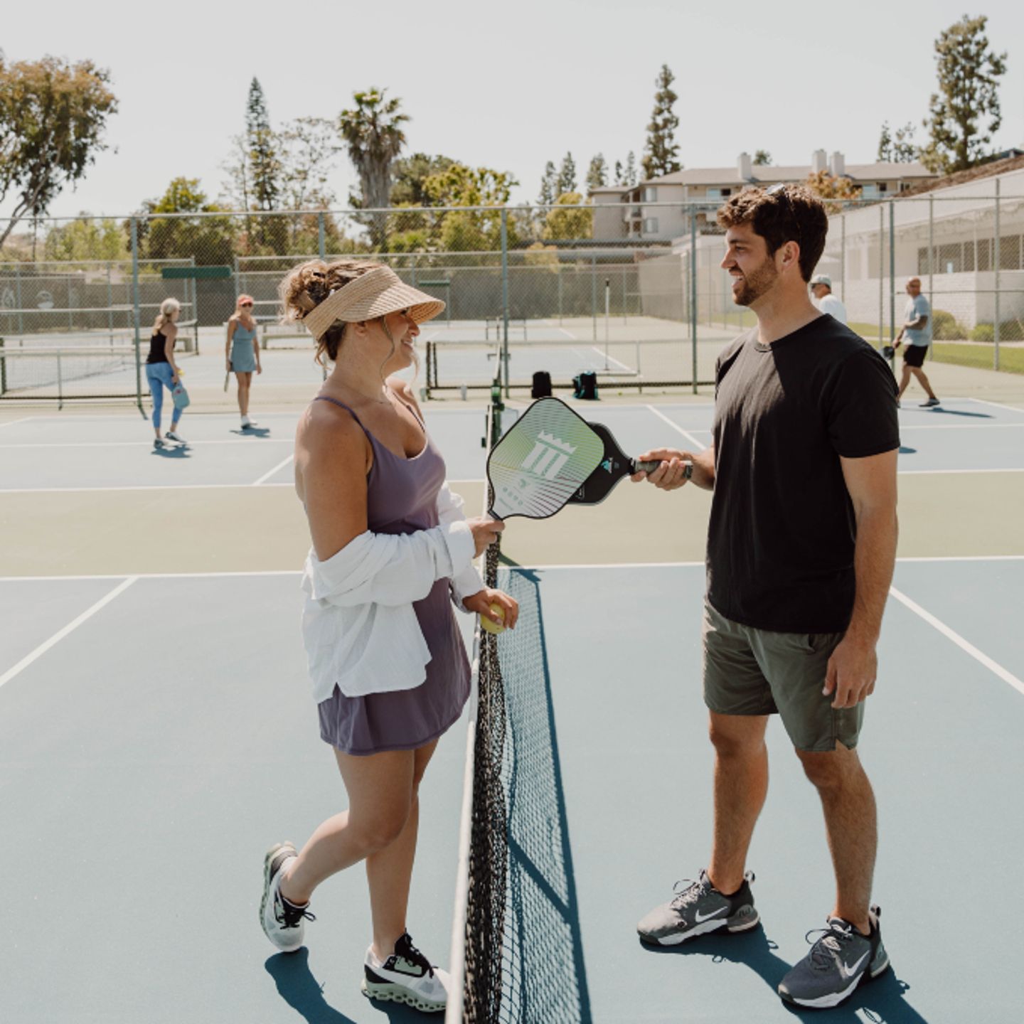 Couple playing pickleball