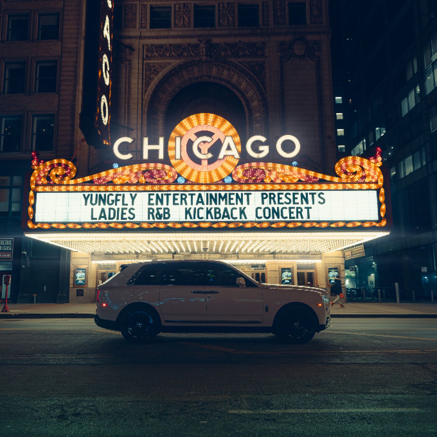 Car in front of Chicago Theatre