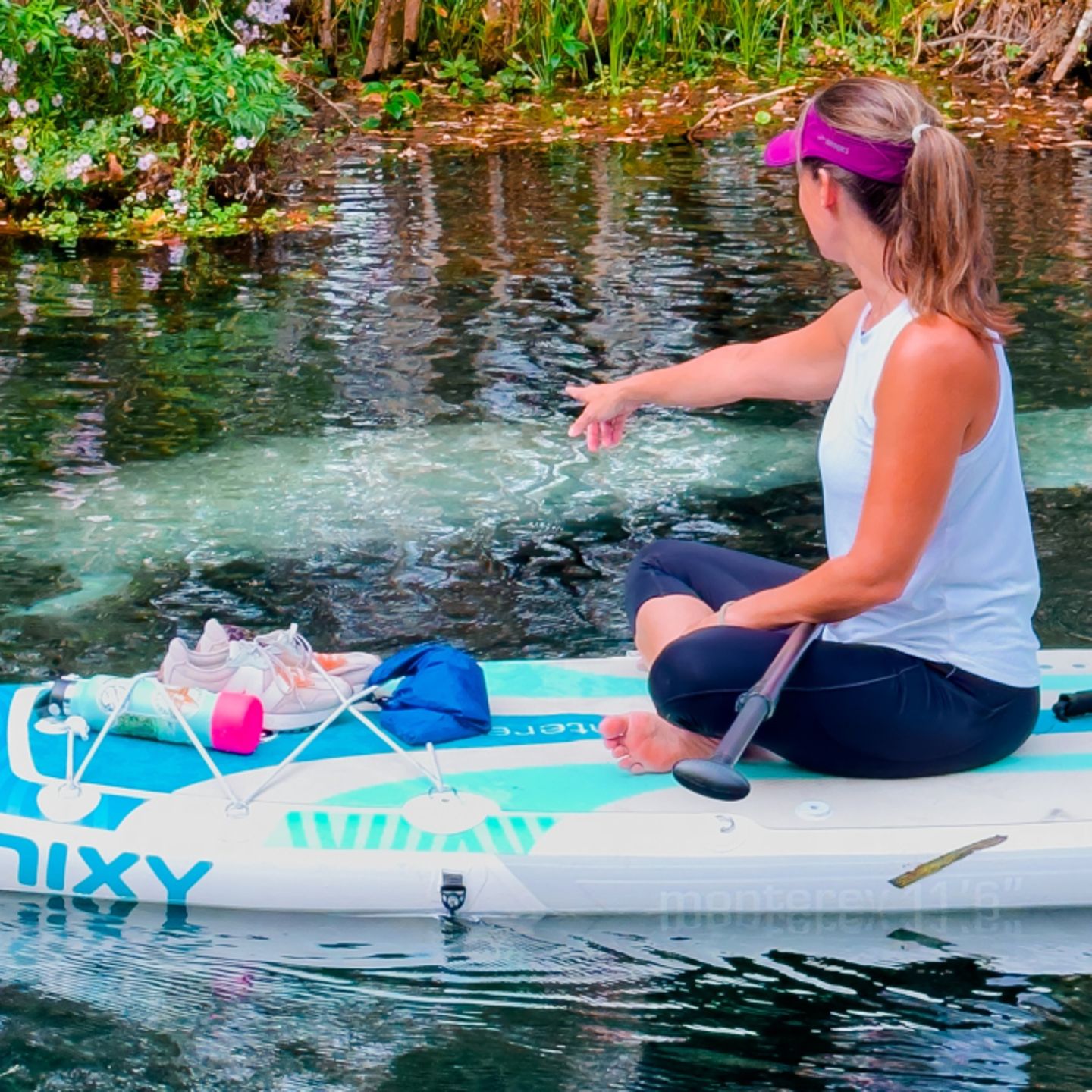 Woman pointing at manatee
