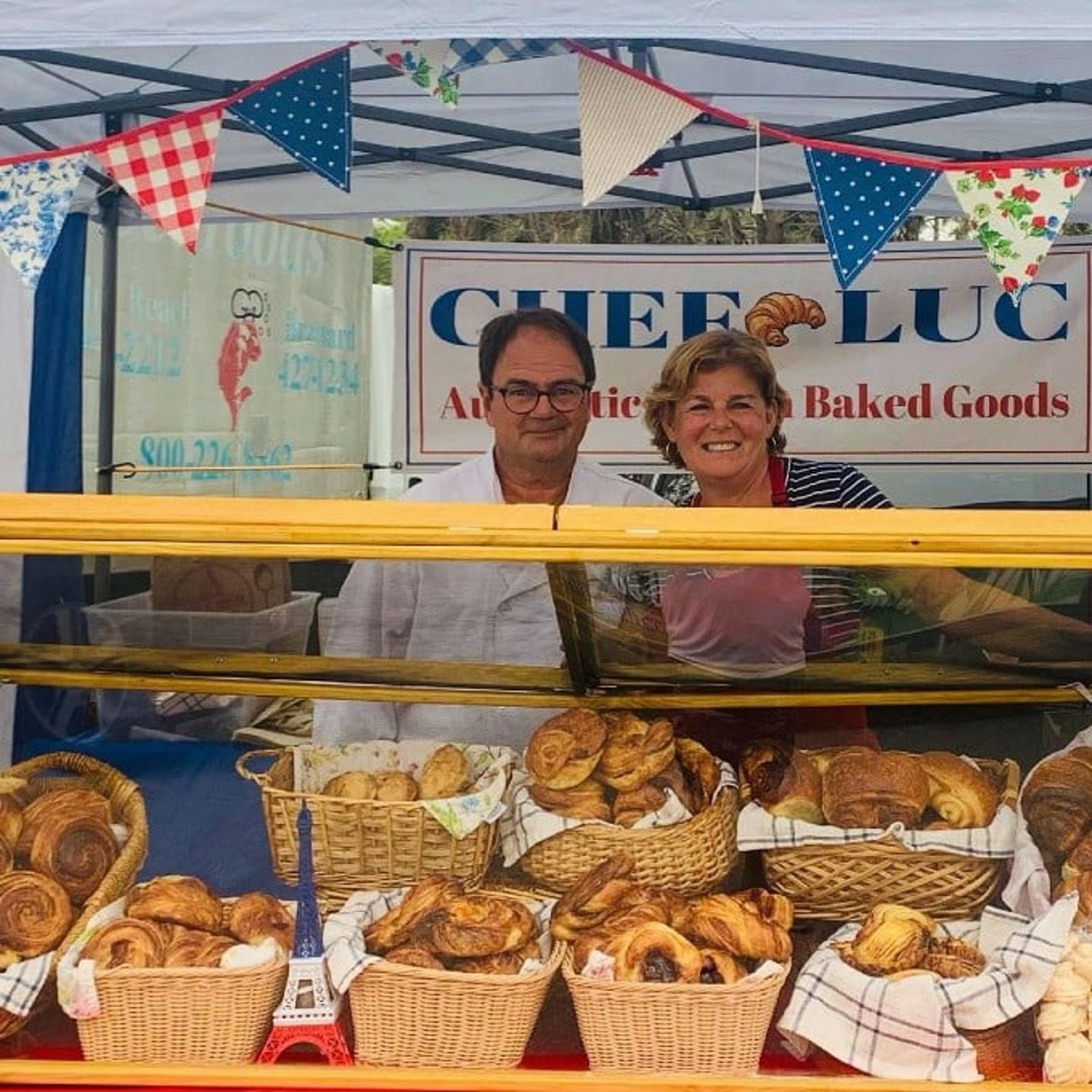 Two people next to booth