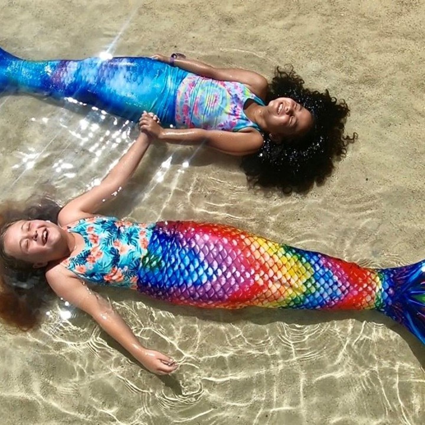 Two kids as mermaids