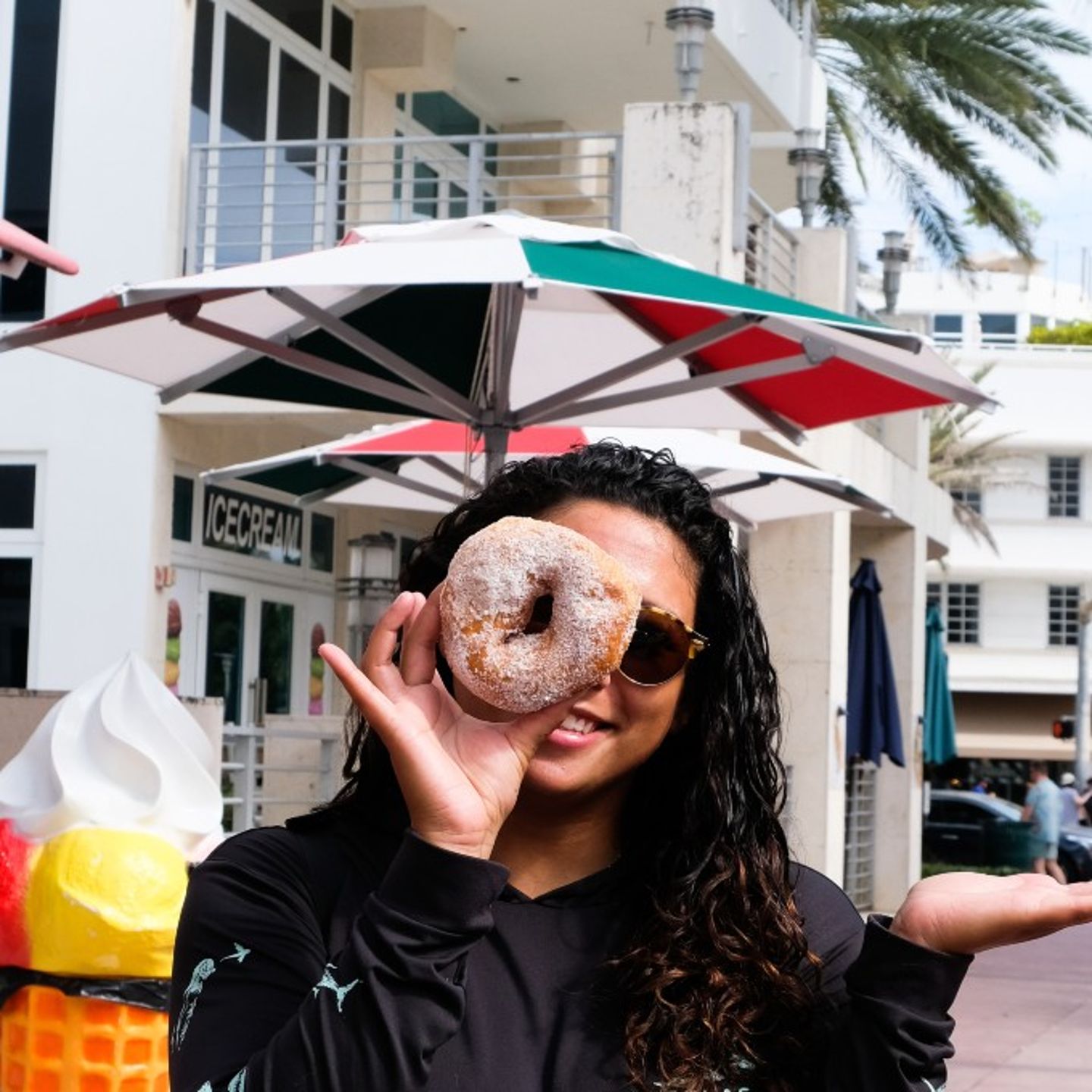 Girl Holding Donut up to Face