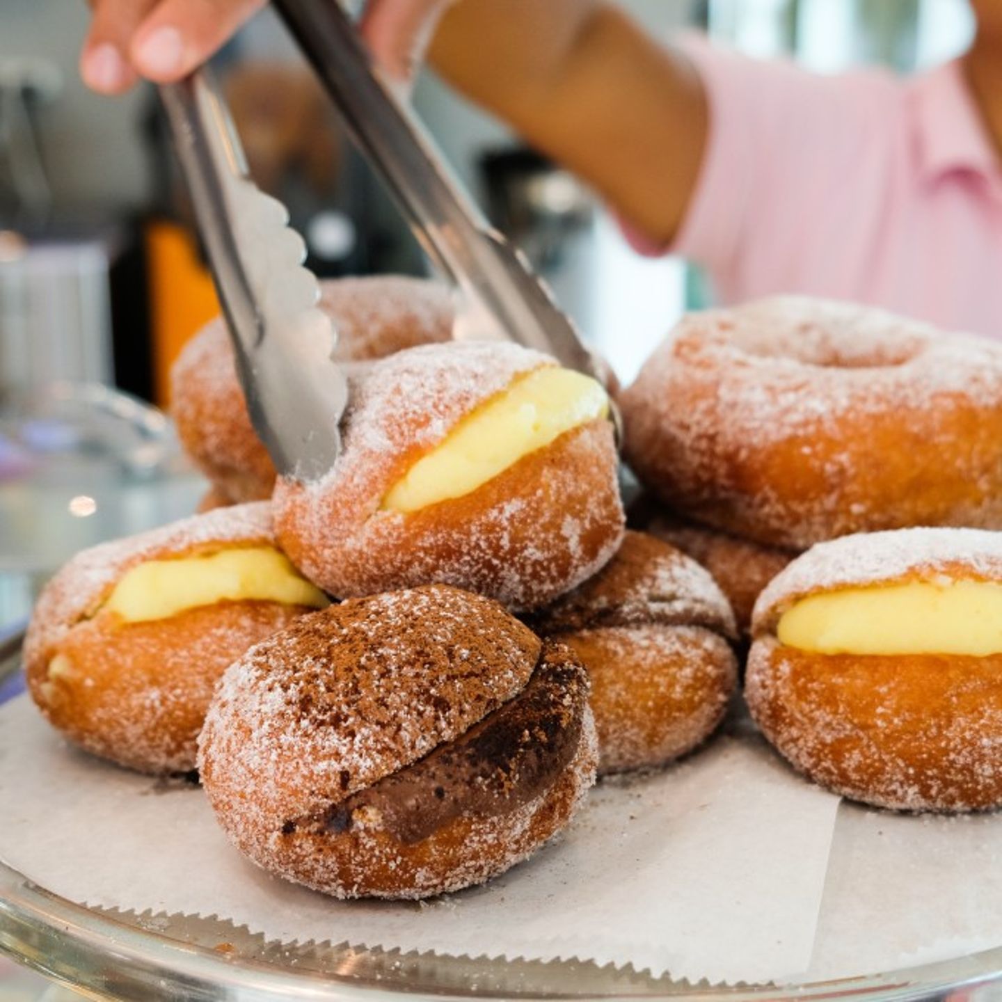 Donut Being Grabbed with Tongs