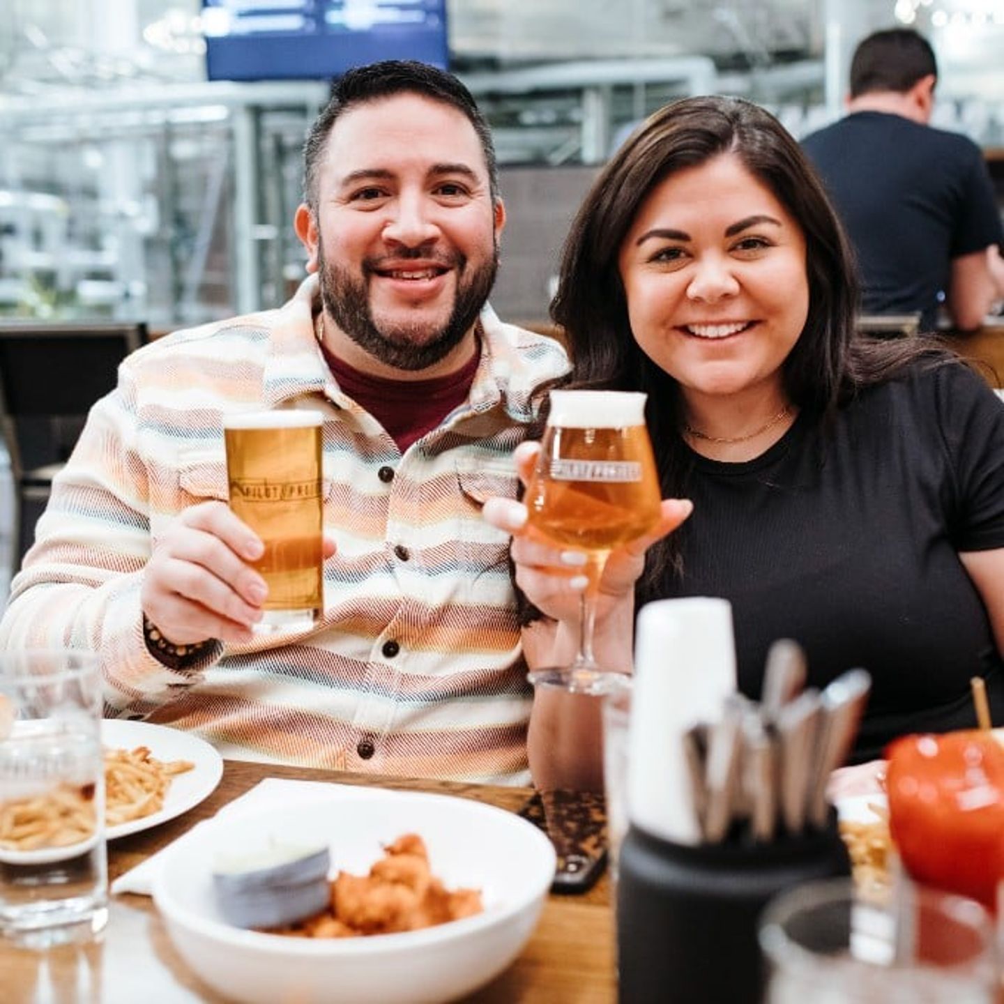 Couple enjoying food and drinks