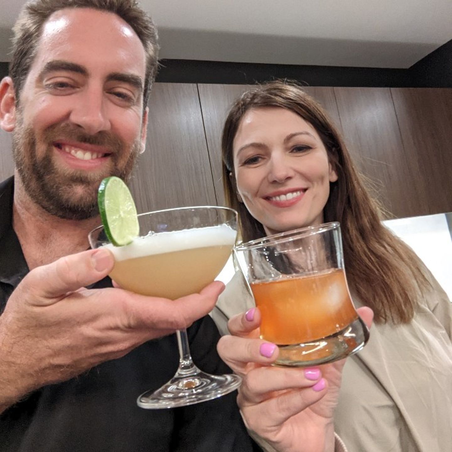 Couple Holding Finished Drinks