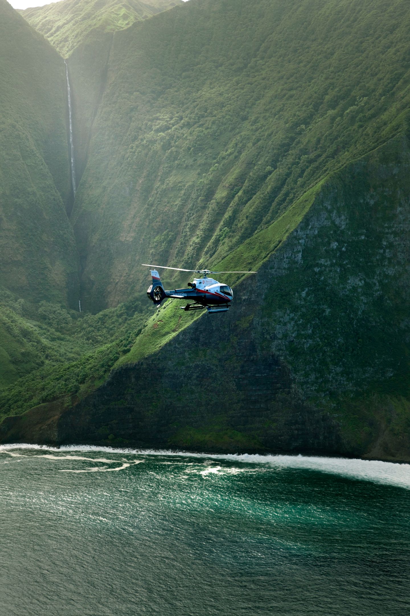Helicopter by mountains