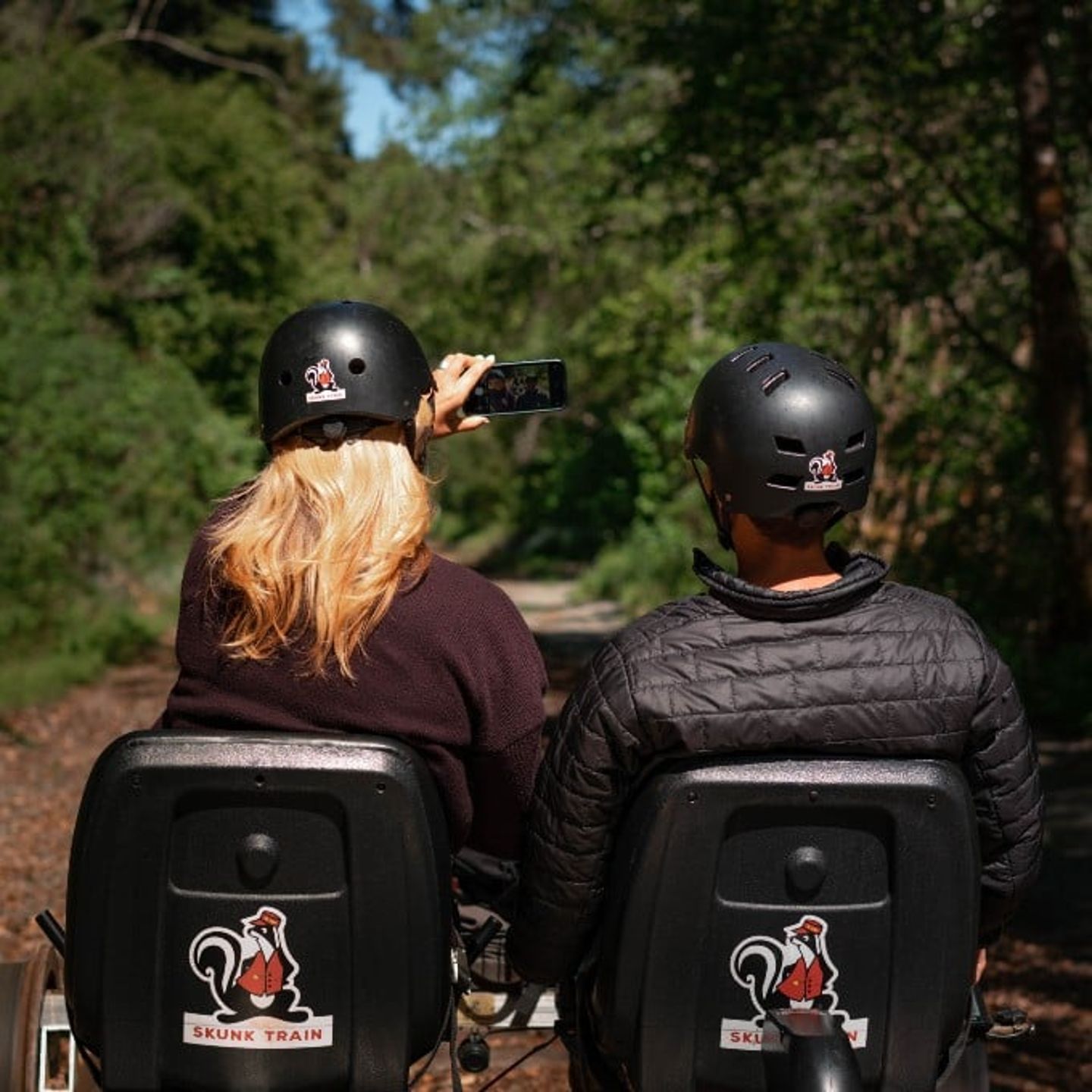 Two people taking selfie on railbike